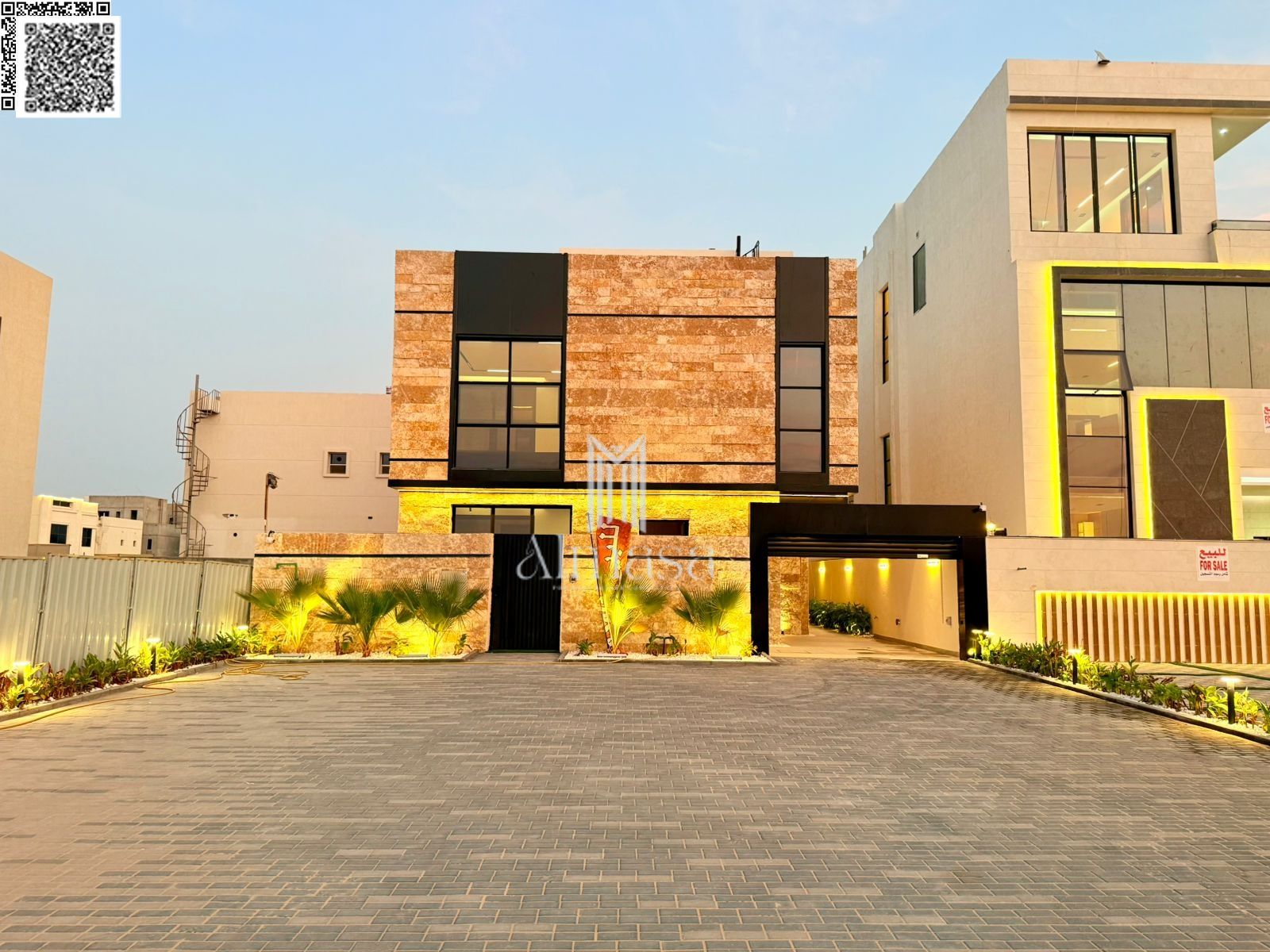 A luxurious, modern villa with a full stone facade and an exceptionally opulent interior featuring high-end hotel-style finishes, including registrati