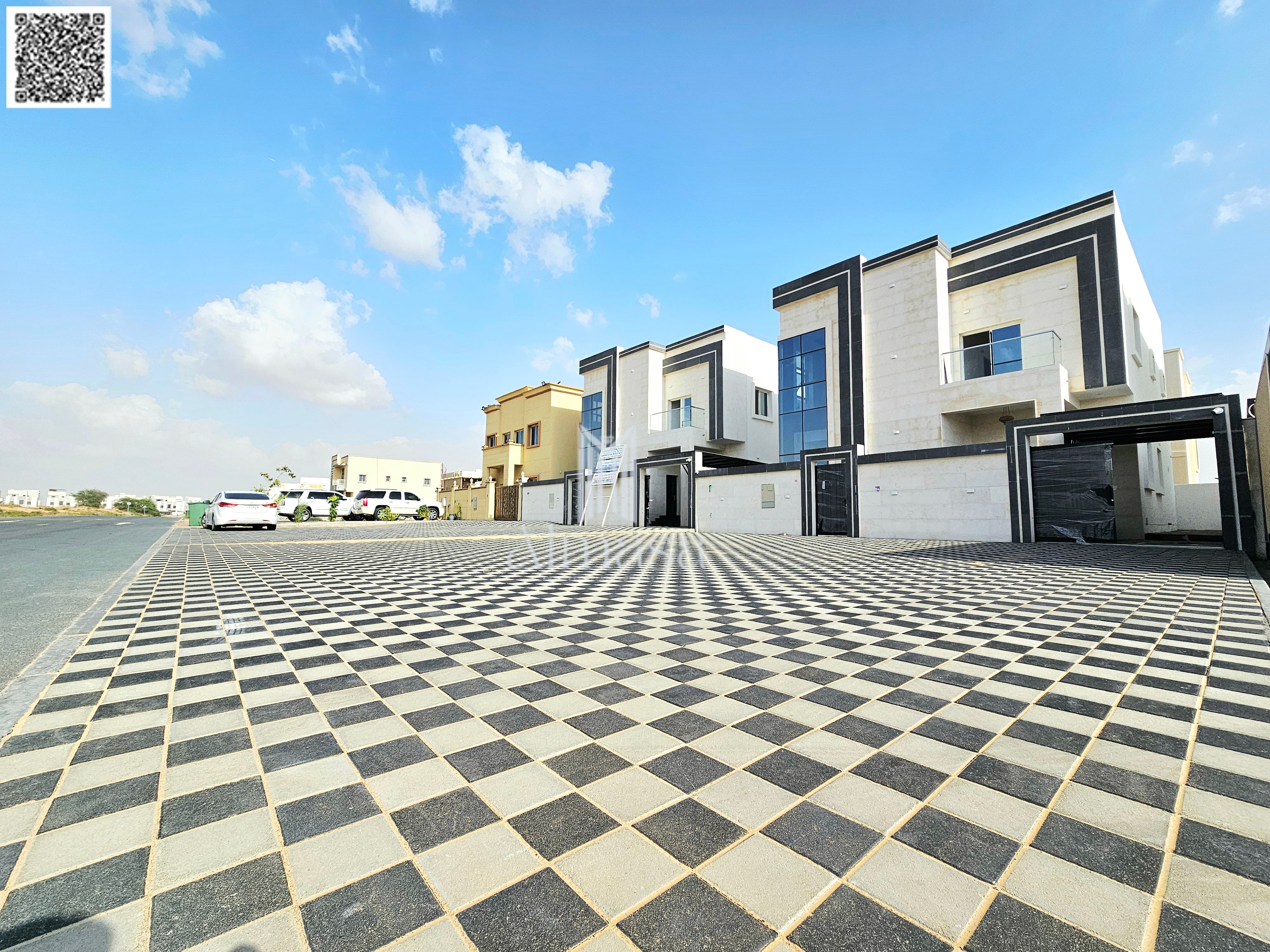 Modern villa with a stone facade, custom finishing, large front yard.