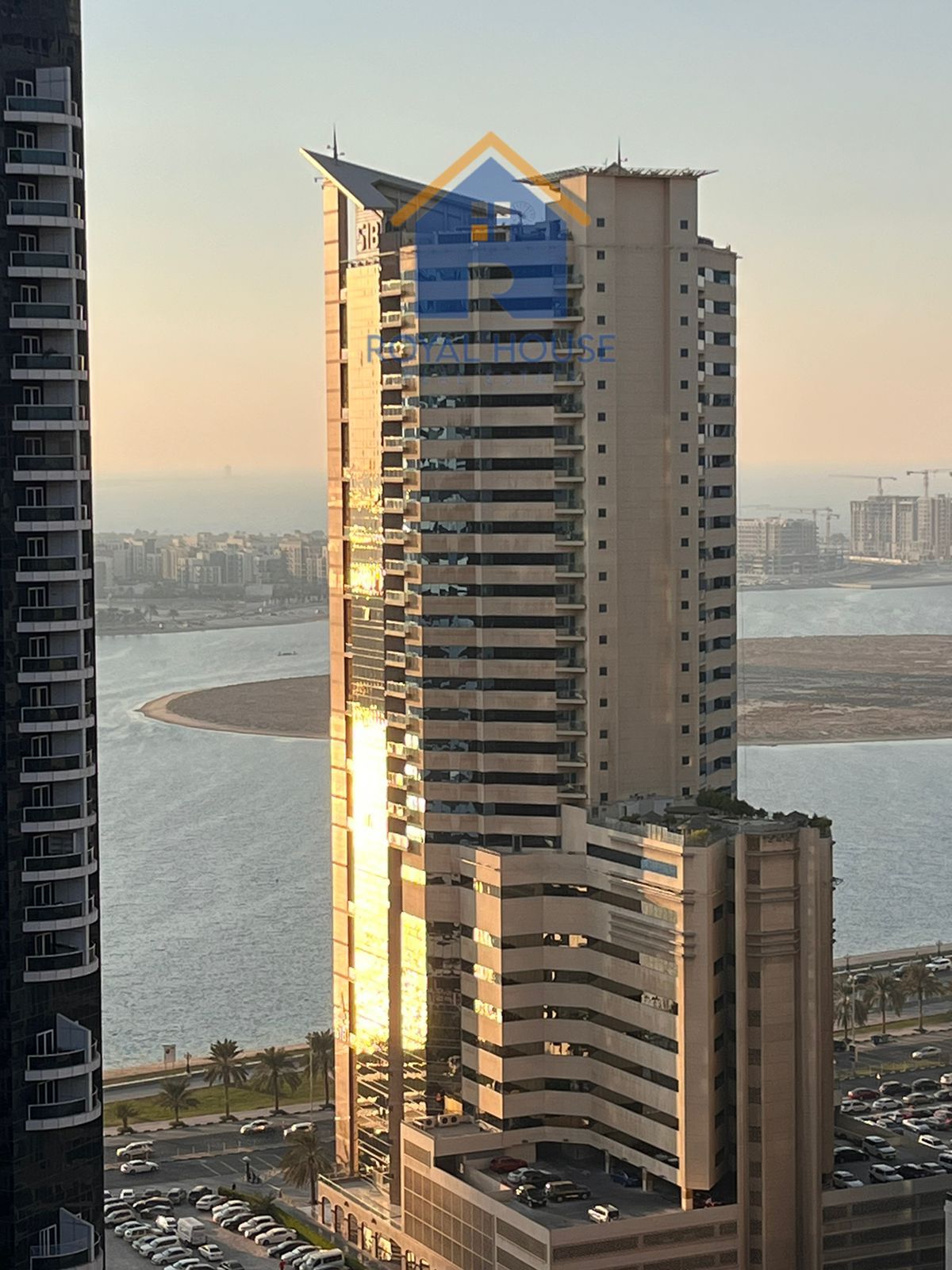 Two bedrooms and a living room for sale in Al Taawun, with a side view.