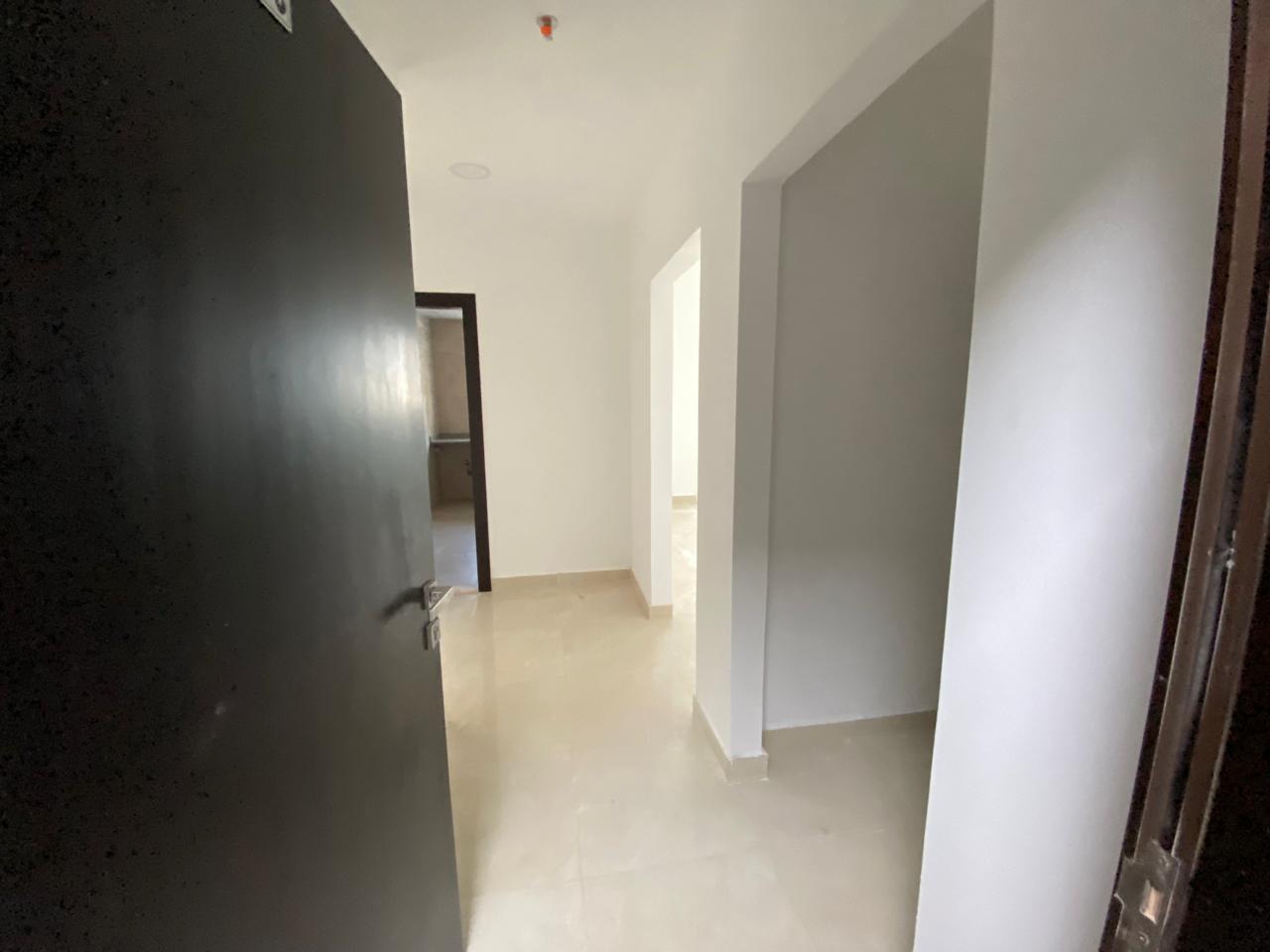 One bedroom, living room, two bathrooms, and balcony in Al-Jarf 3. First occupancy, large area.