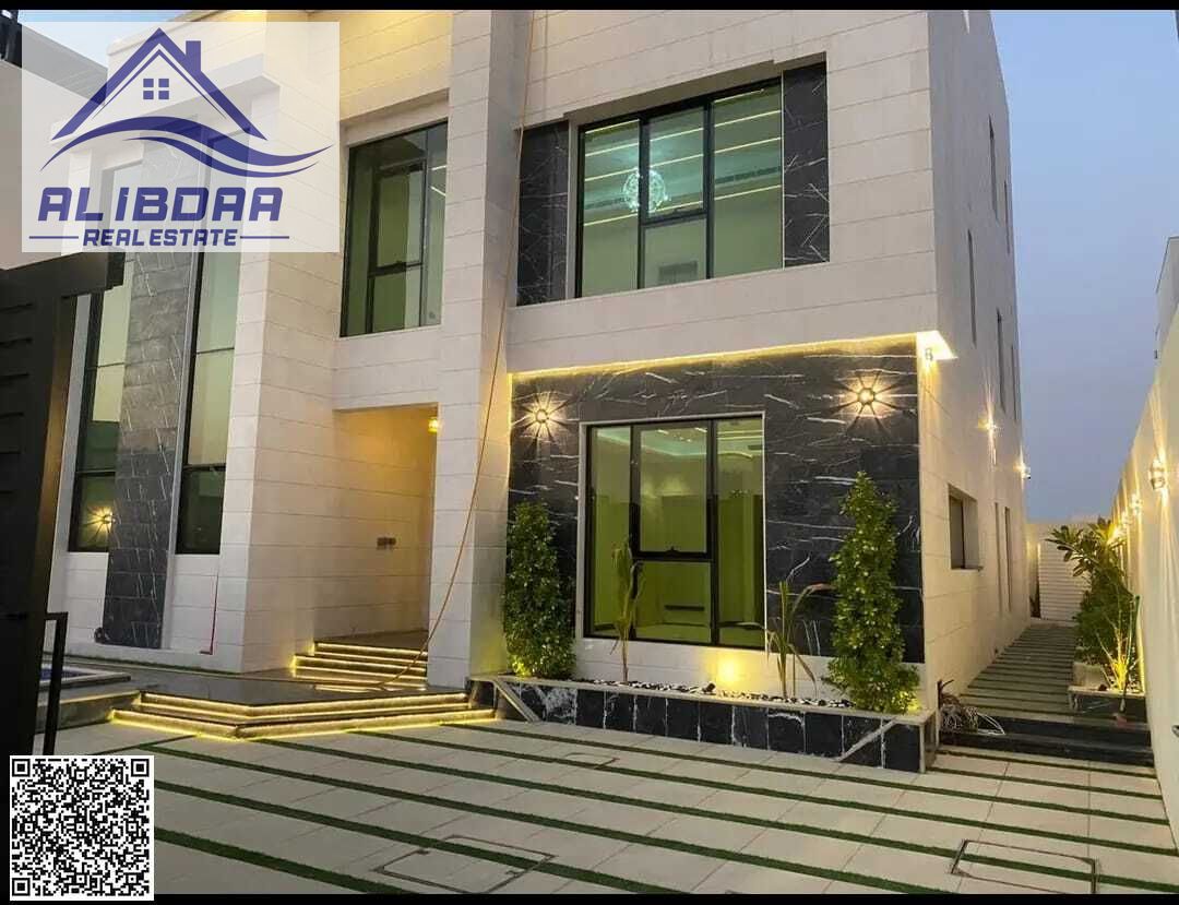 Luxury villa with a swimming pool and spacious grounds for sale in Al Alia area