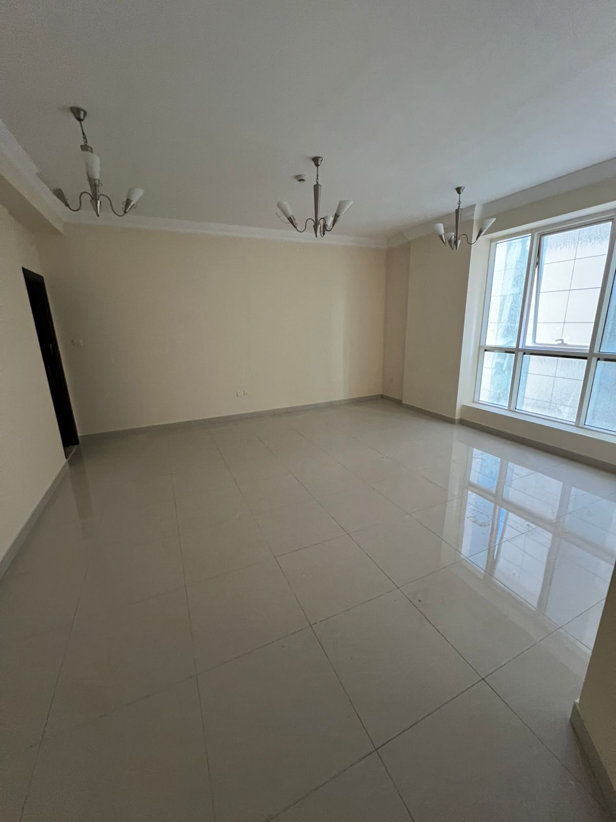 For annual rent in Sharjah, Al Majaz 2 area: 2 bedrooms, a living room, 2 bathrooms, and a balcony with parking.