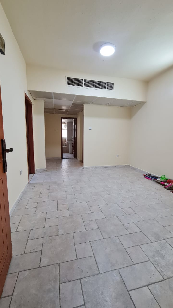 One-bedroom apartment with central AC in Sharjah Al Shuweihan, ideal for small families, near all services and malls.