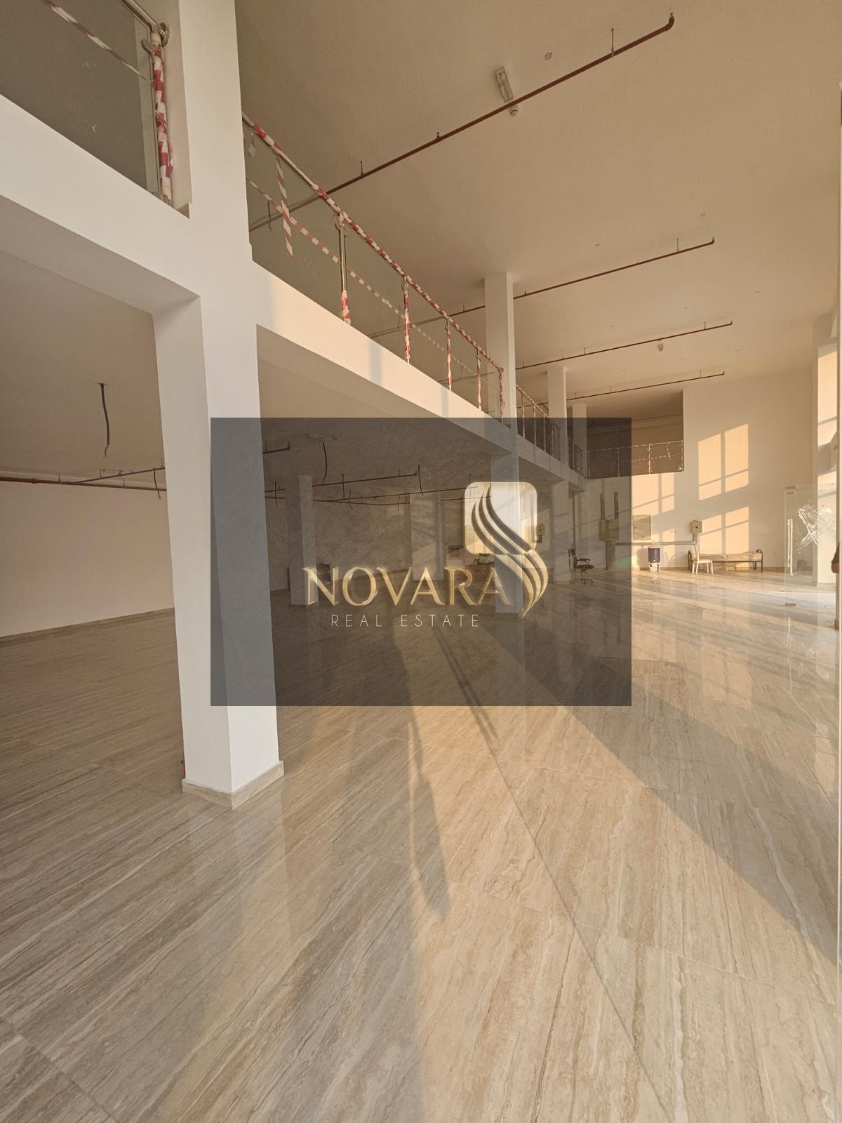 A showroom with a total area of 8,300 square feet and a large outdoor setback area suitable for product display or customer parking.