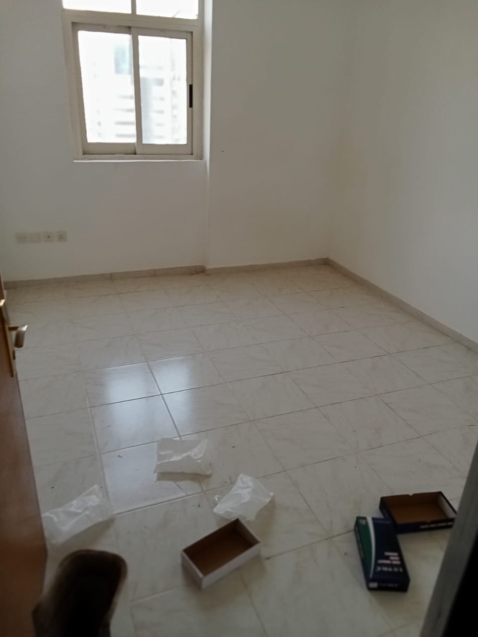 For annual rent in Sharjah, Al Qasimi area: 2 bedrooms, a living room, 2 bathrooms, and a balcony.