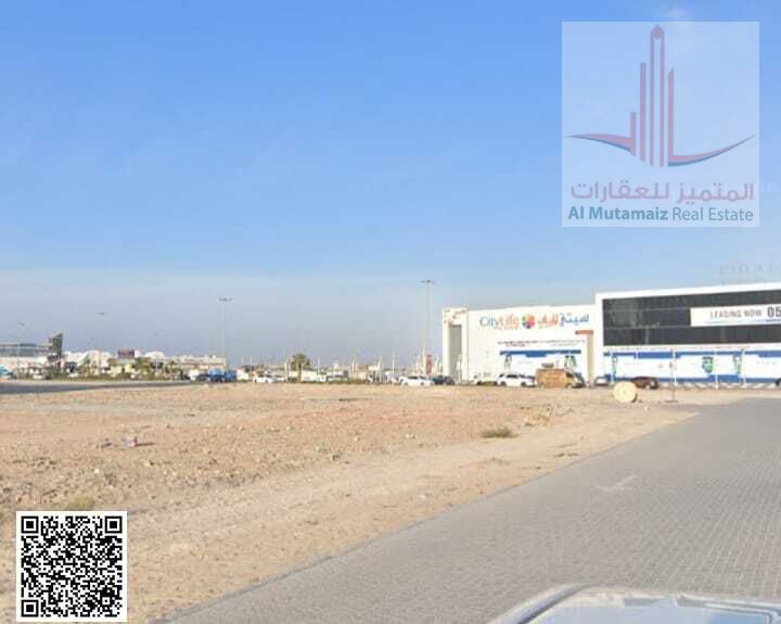 Land for sale in Ajman, Al Rashidiya area, residential/commercial G+12, 10,170 sq ft, corner plot on two streets, excellent location. Asking AED 4,5M