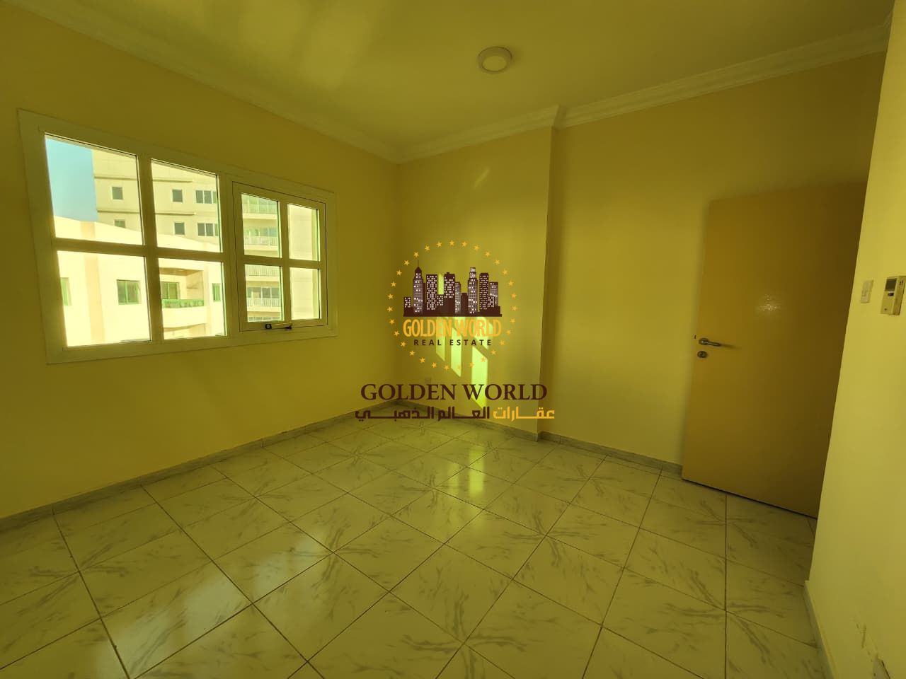 Two-bedroom apartment with living room for annual rent in Al Qasimia Al Nad, Sharjah. Prime location, modern kitchen, central AC, free maintenance, 24