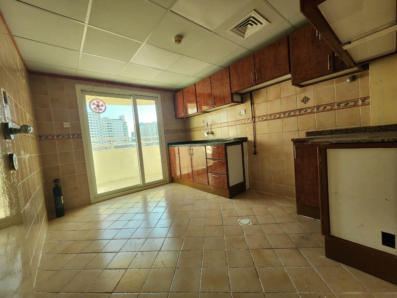 Spacious two-bedroom apartment in Al Qasimia Al Nad with balcony, large living room, two bathrooms, very clean and well maintained.