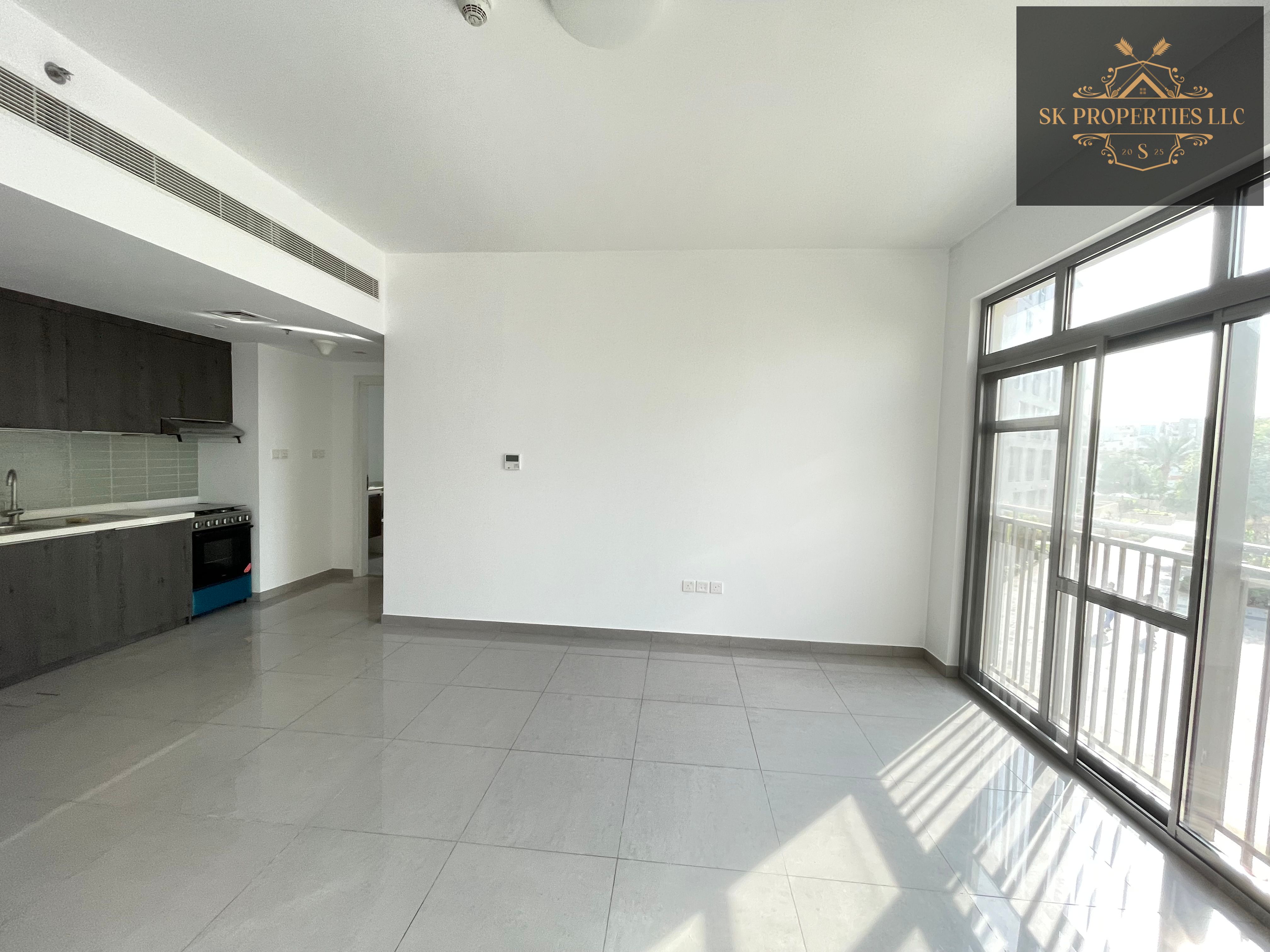 Modern luxury 1 bedroom apartment located in woroud 3 balcony with pool view gym children pool kids play area family friendly atmosphere covered parking lot