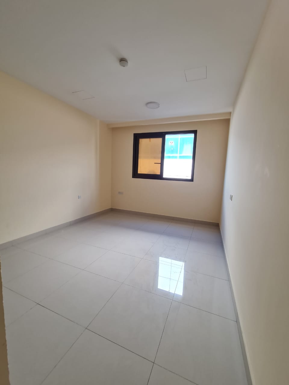 Two bedroom apartment with living room in Sharjah Al Qulayaa. Clean unit with central AC, built in wardrobes, good size and easy access to Ajman.