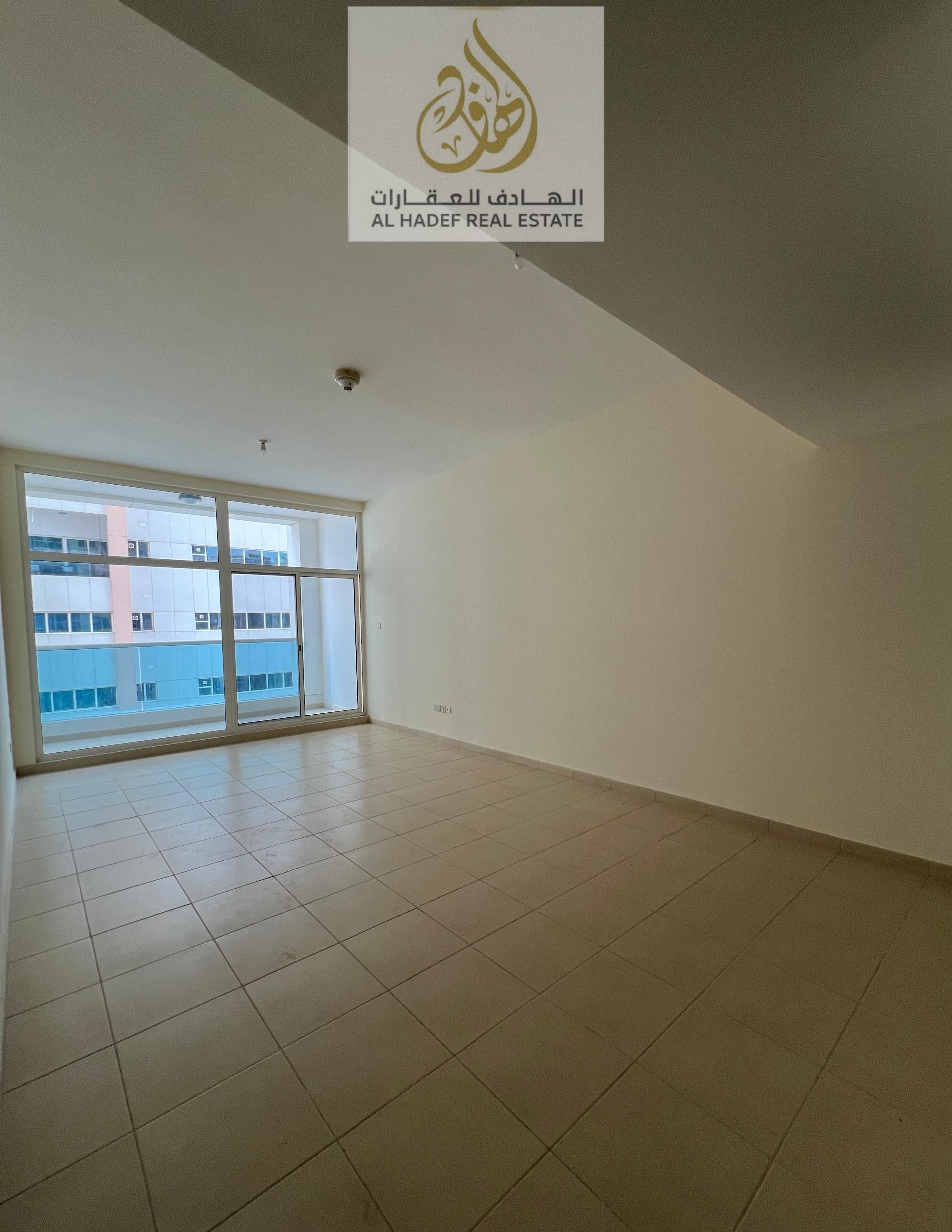 Annual rent in Ajman, Al Rashidiya 3 area, Sheikh Khalifa Street, Ajman Towers. Two-bedroom apartment with a living room, built-in wardrobes, balcony,