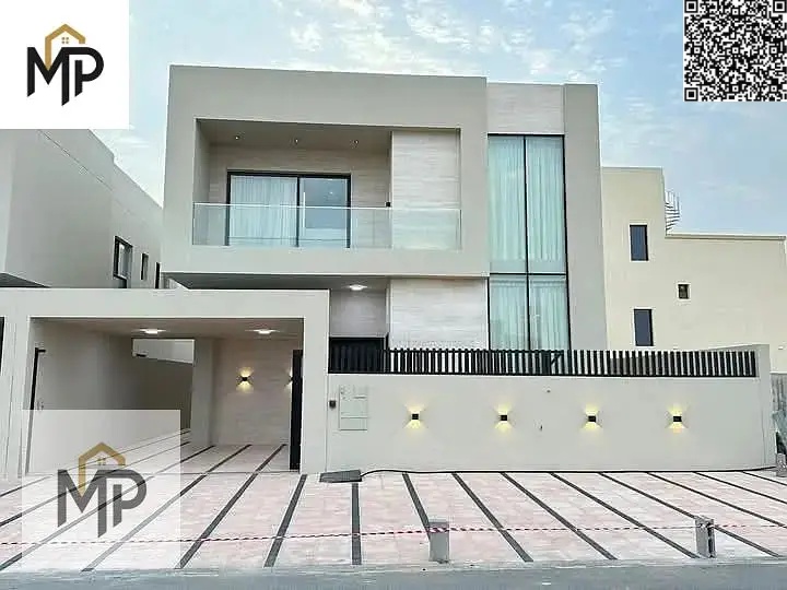 A luxurious villa for sale in Al Zahia area, one of the most prestigious areas of Ajman, with an elegant design and high-quality finishes, featuring a
