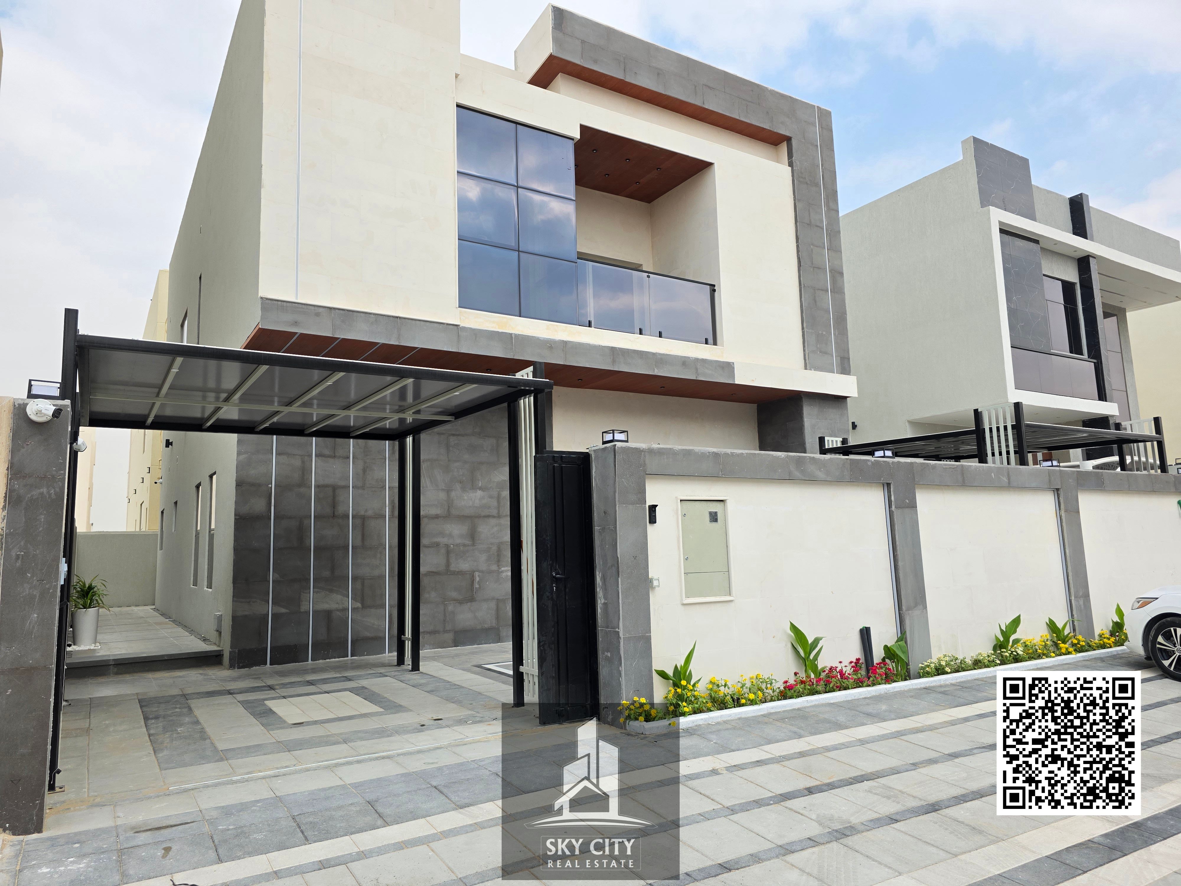 Al-Haliyo, Ajman, behind Emirates Towers. 4 master bedrooms, majlis, 2 living rooms, maid's room, large yard, barbecue area, and outdoor seating. Includes registration and ownership fees. Freehold ownership for all nationalities.