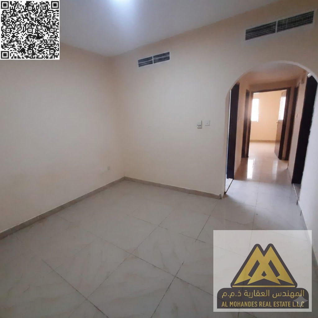 Two bedrooms and a living room with two bathrooms | Prime location near the Sharjah and Dubai exit and close to all services | Central air conditionin