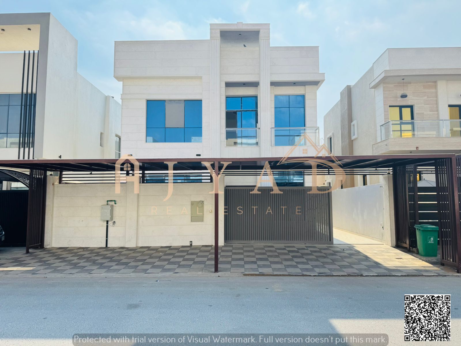 Villa for sale in Al Yasmin, Ajman. Includes registration fees, electricity, water, and air conditioning. 5 master bedrooms, a majlis, a living room w