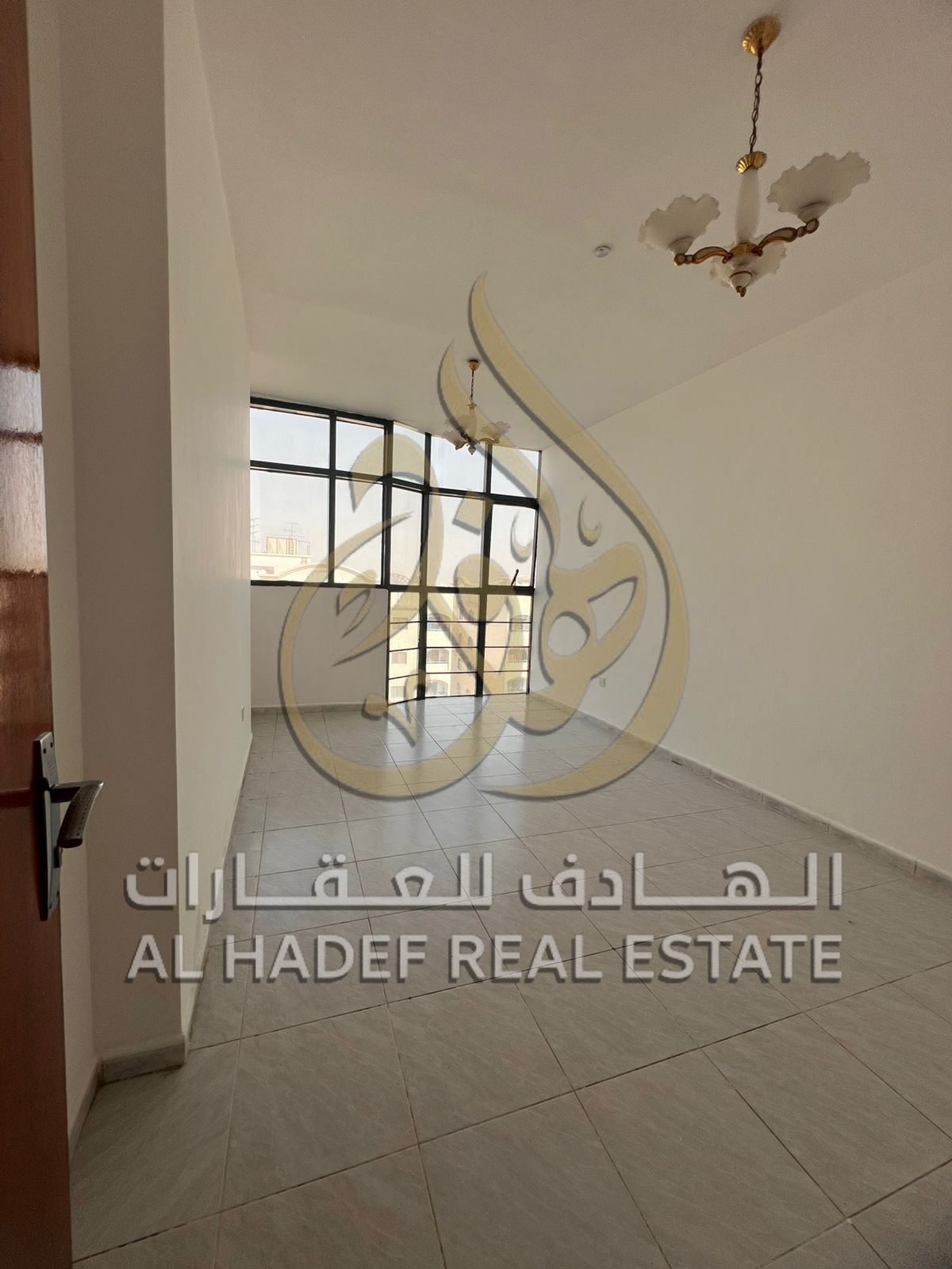 For rent in Sharjah – Abu Shagara: a two-bedroom apartment with a living room, air conditioning included, one month free. Excellent location, suitable