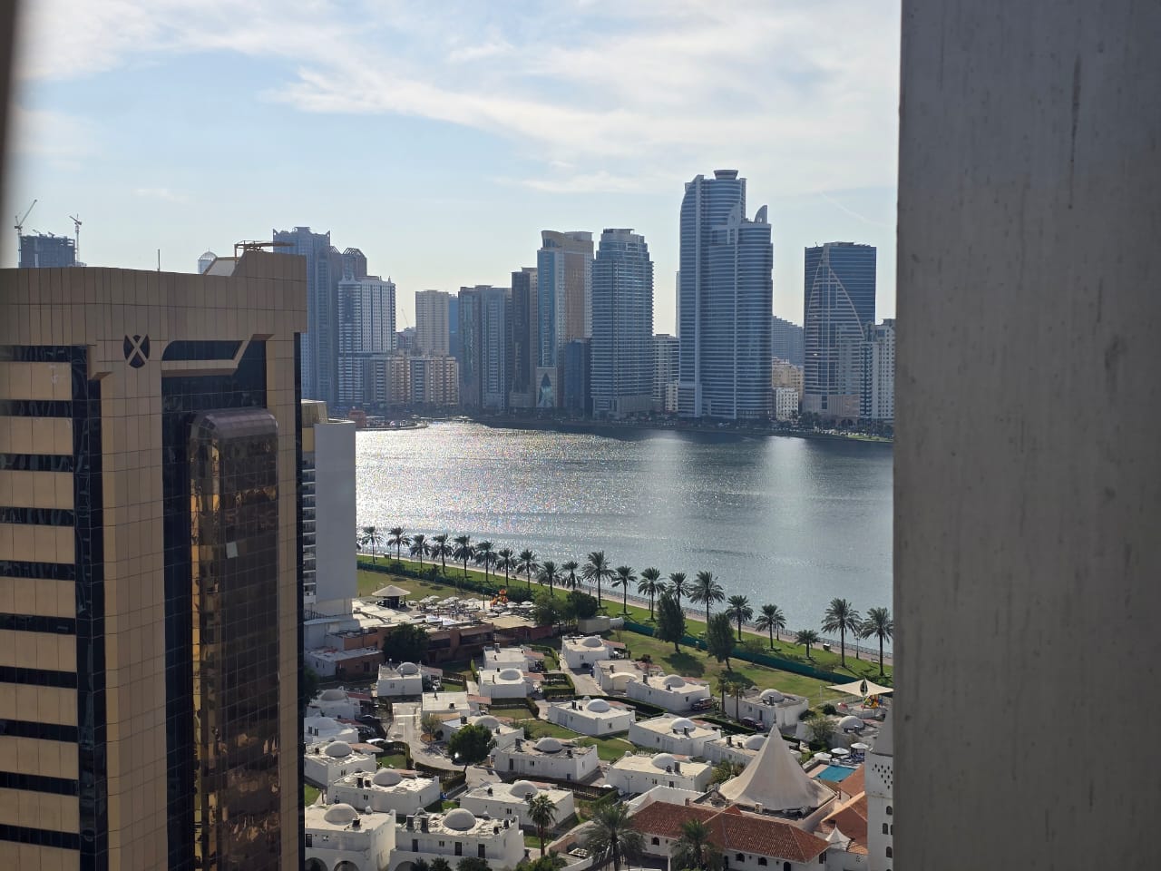 One-bedroom apartment in Al Majaz 1 with free AC, master bedroom, sea view, two bathrooms, delivered after full maintenance with flexible payment opti