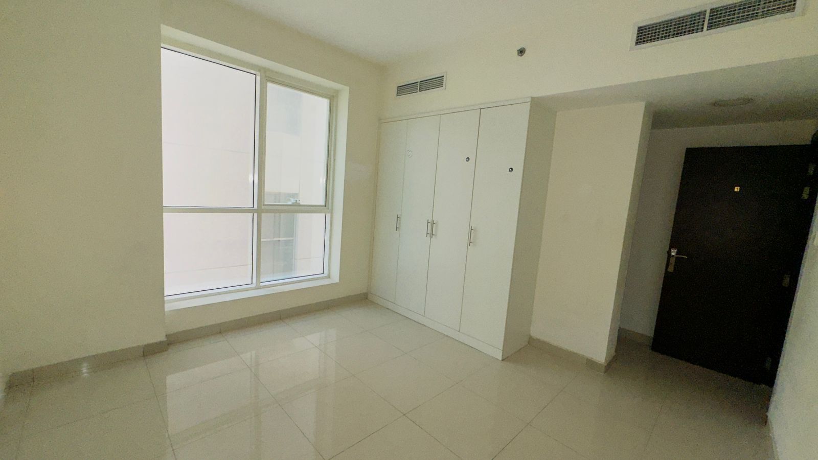 Limited offer: 2-bedroom apartment with living room in Al Majaz 2 for 45,000 AED. Family-friendly, prime location near all services.