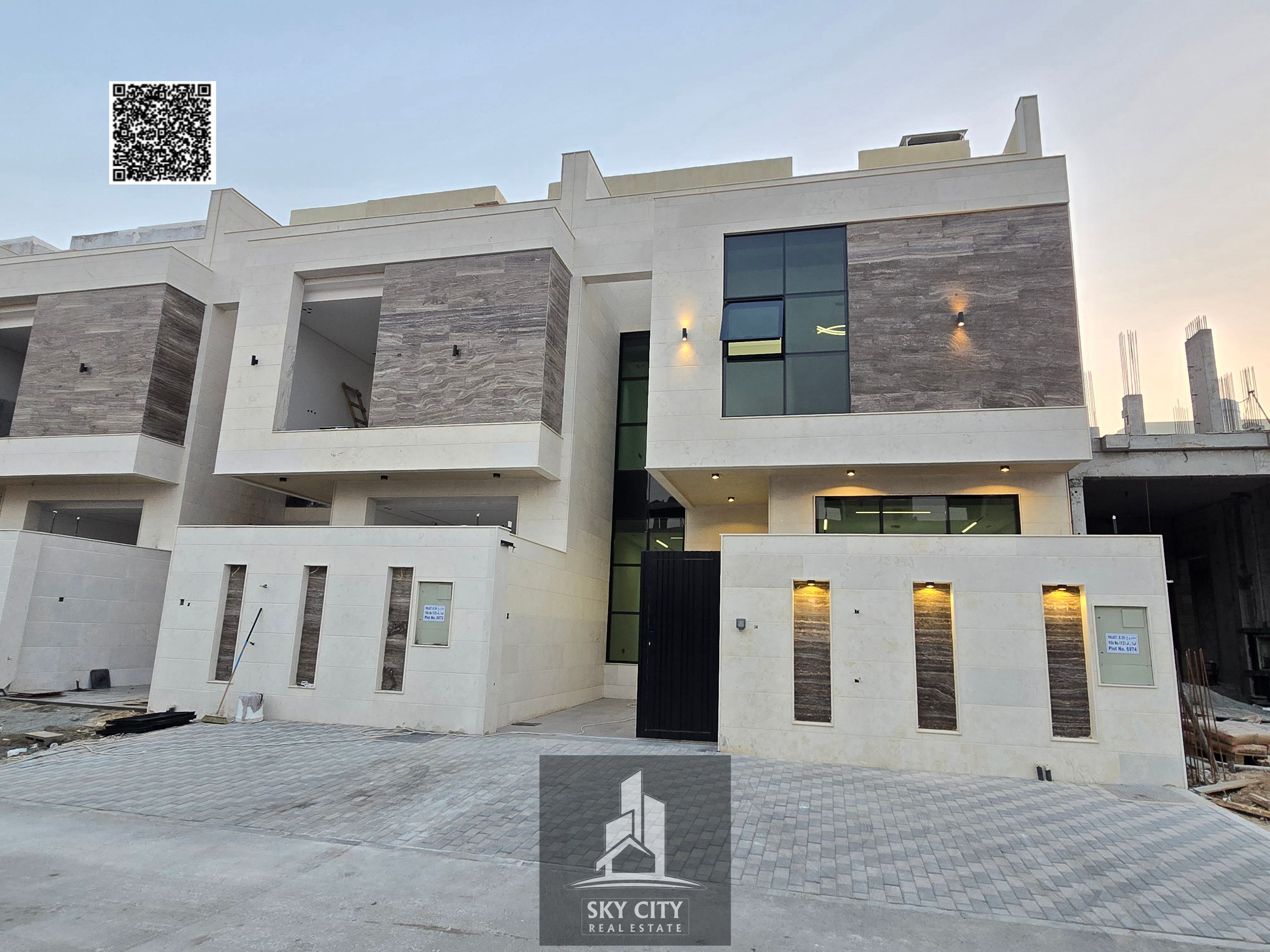 For sale opposite Al Rahmaniya, Sharjah: ground floor, first floor, and roof, including registration and ownership fees.