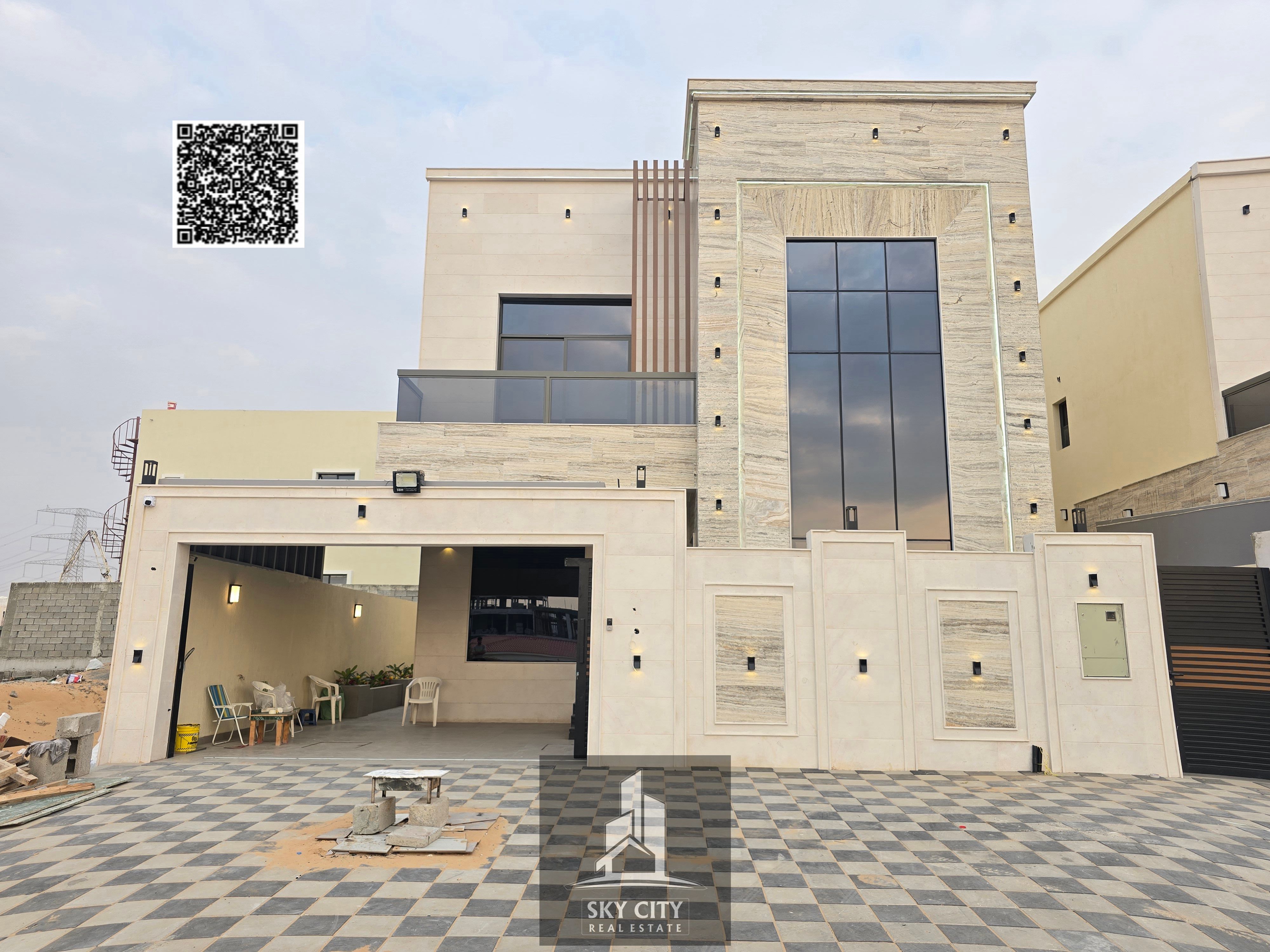 Villa for sale, including registration and ownership fees, opposite Al Rahmaniya, Sharjah, and near Emirates Road.