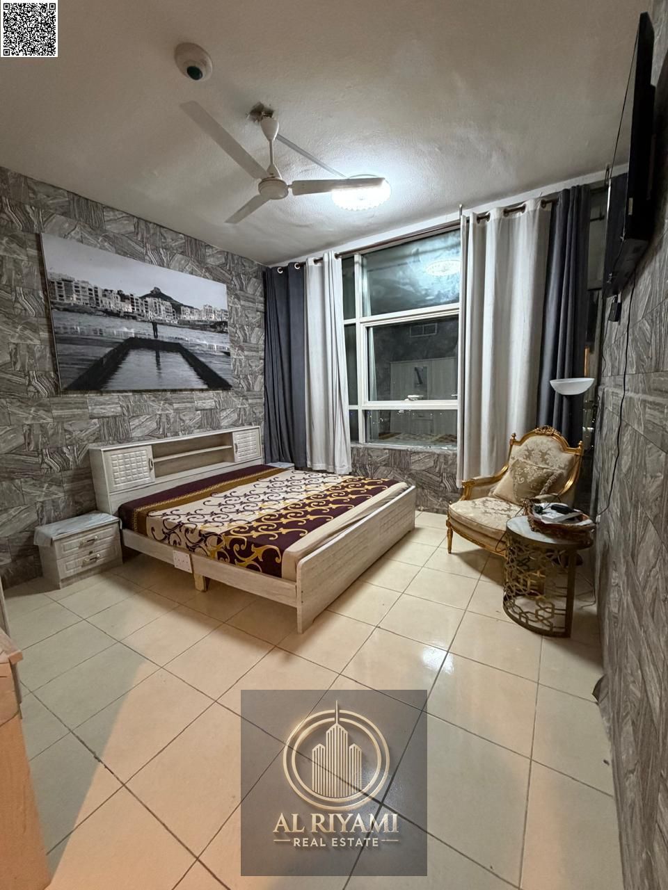 Two-bedroom apartment for monthly rent Living room divided into two bedrooms (3-bedroom layout) Orient Towers - Al Bustan