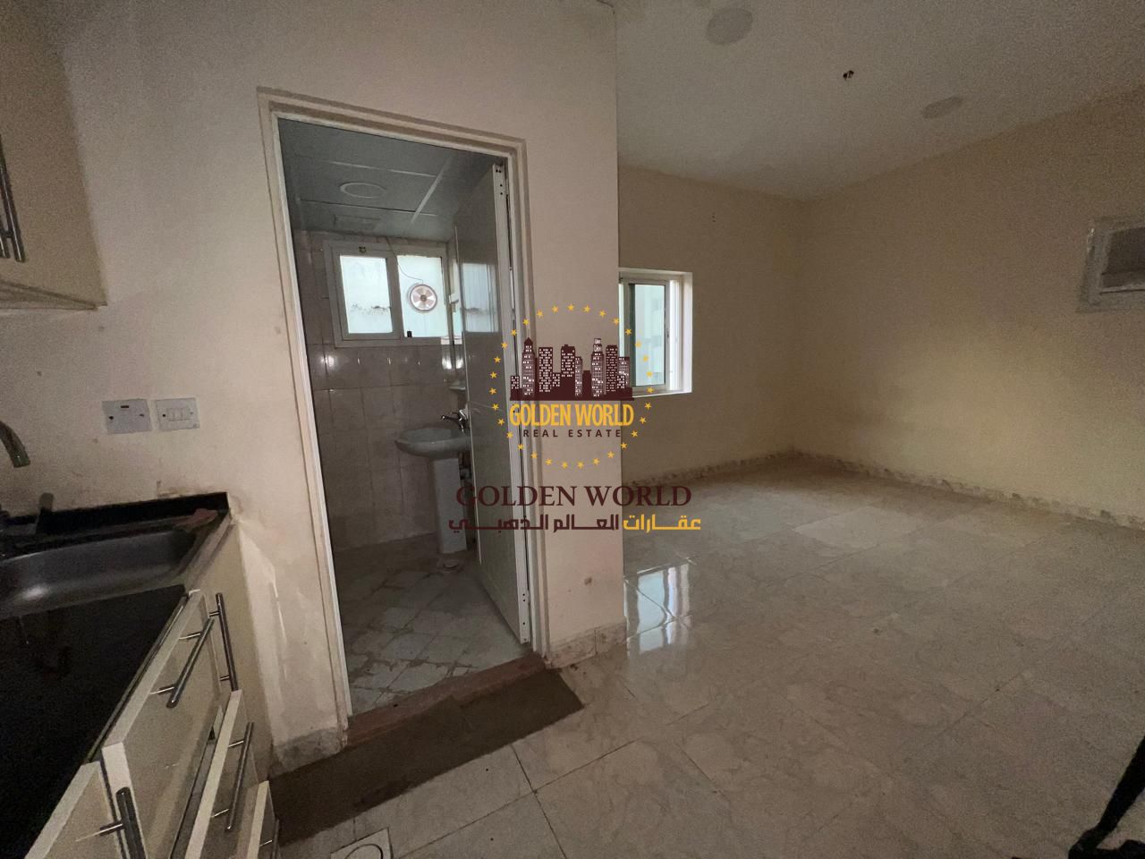 Studio apartment for rent in Al Nabaa, Sharjah, featuring an open American kitchen, practical layout, and affordable annual rent.