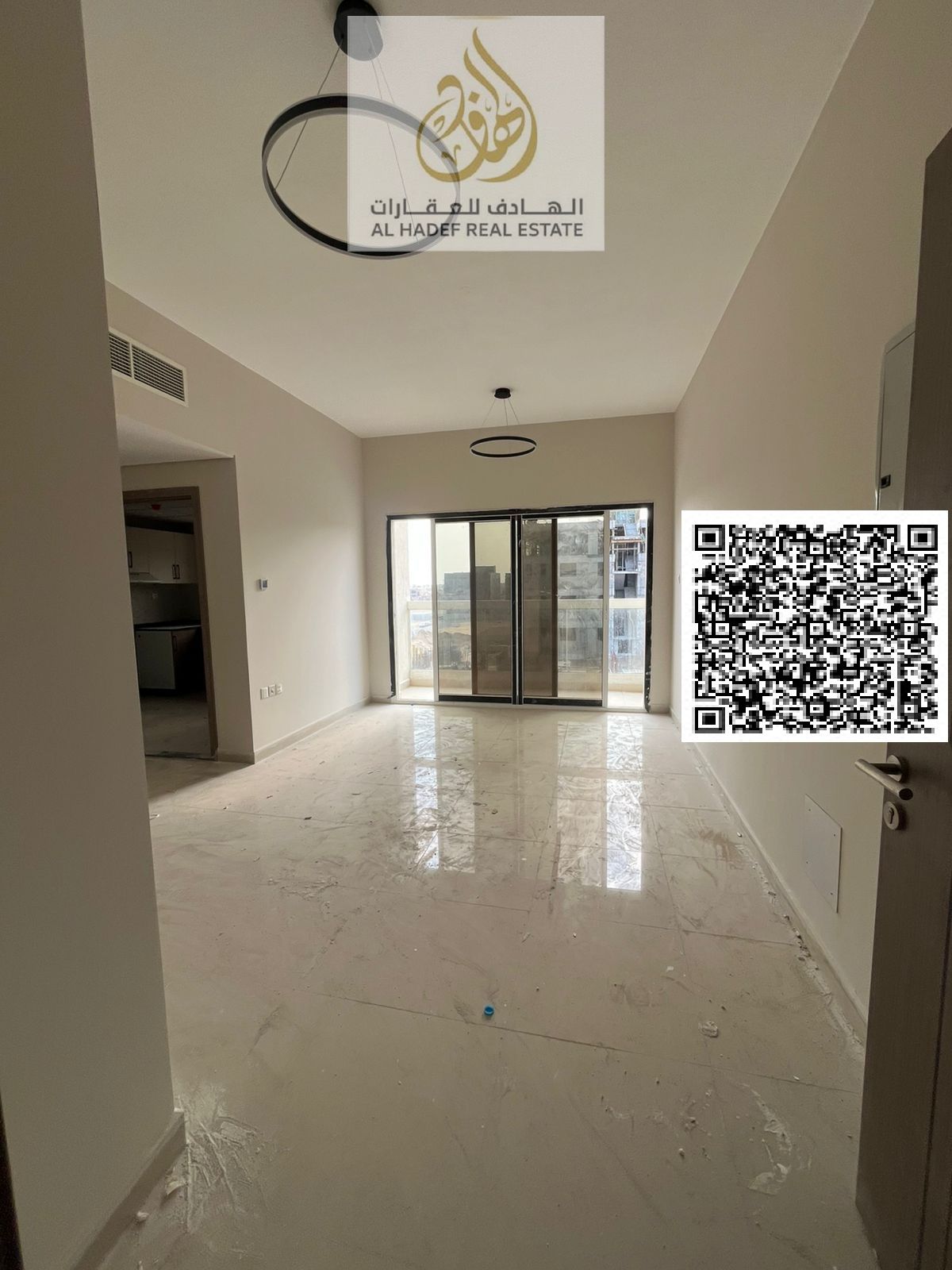 Two bedrooms, a living room, three bathrooms, and a balcony. First occupancy. Very spacious. Super deluxe finishing. Prime location in Al Jurf 3, clos