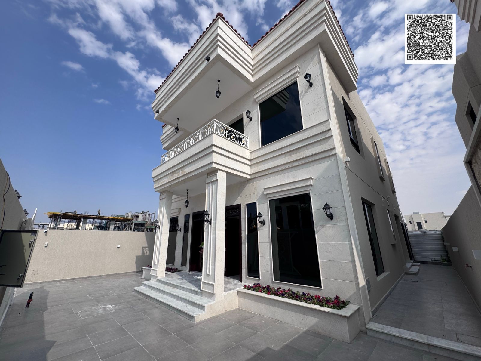 Villa for sale in Ajman, Al Helio 2 area. The villa has two floors and consists of 4 master bedrooms, a majlis (formal sitting room), a living room, a