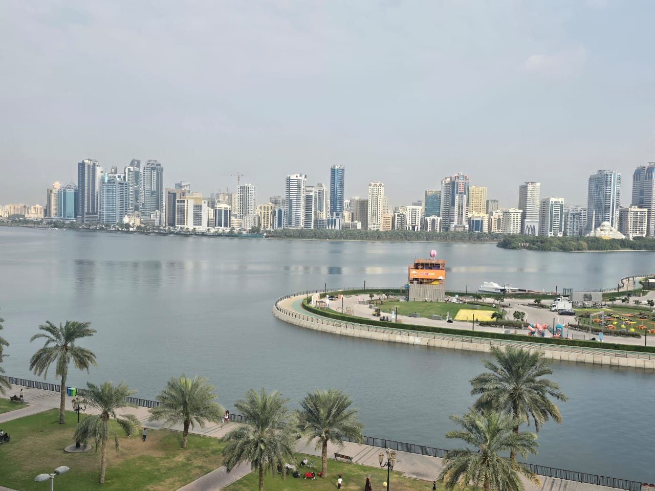 Luxury 4BR apartment with two living rooms in Al Majaz 3, full sea view, free AC and parking, very spacious layout.