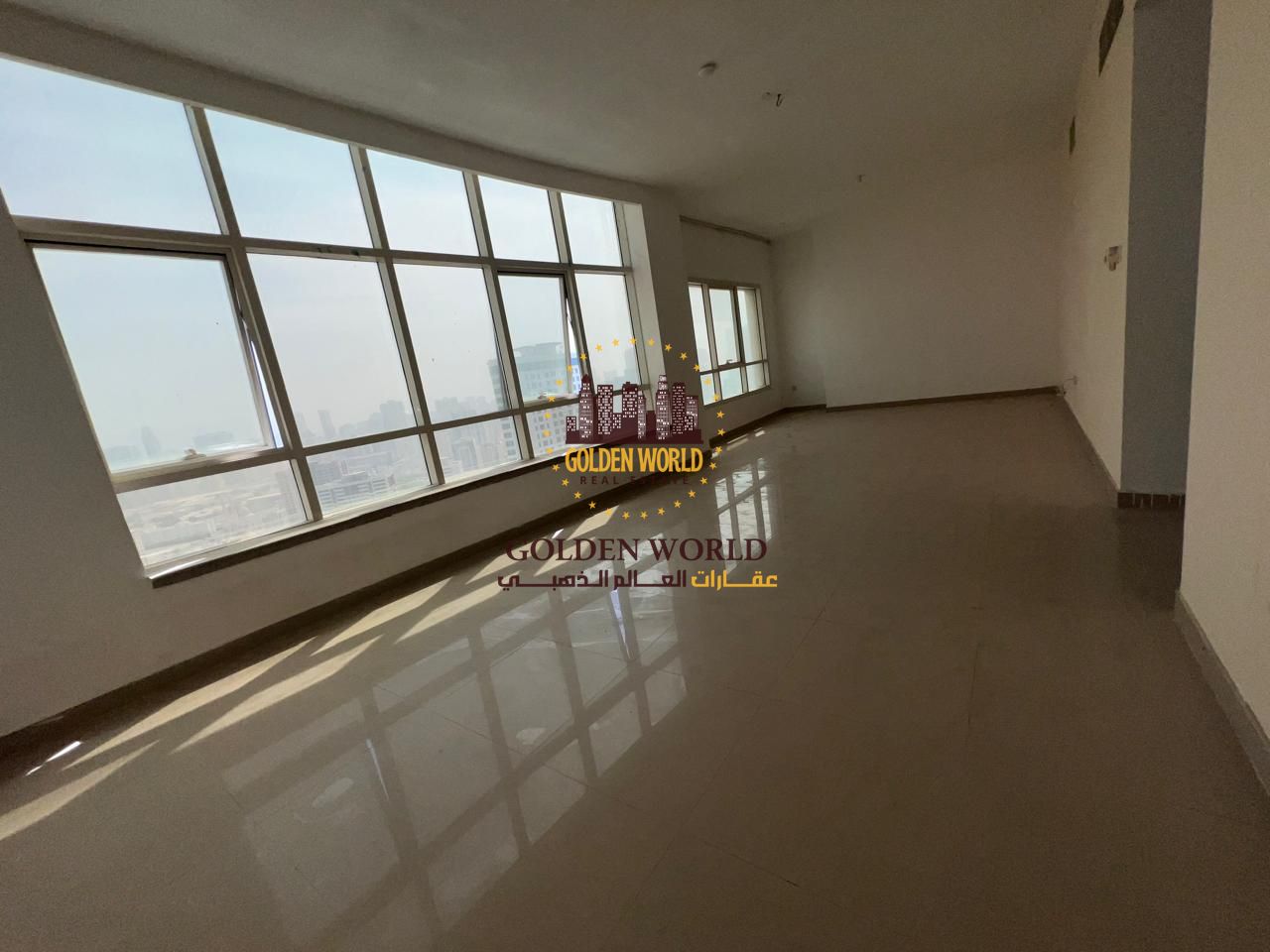Two-bedroom apartment with living room in Al Majaz 2, free parking, small balcony in the kitchen, built-in wall cabinets, and 3 bathrooms, in a quiet