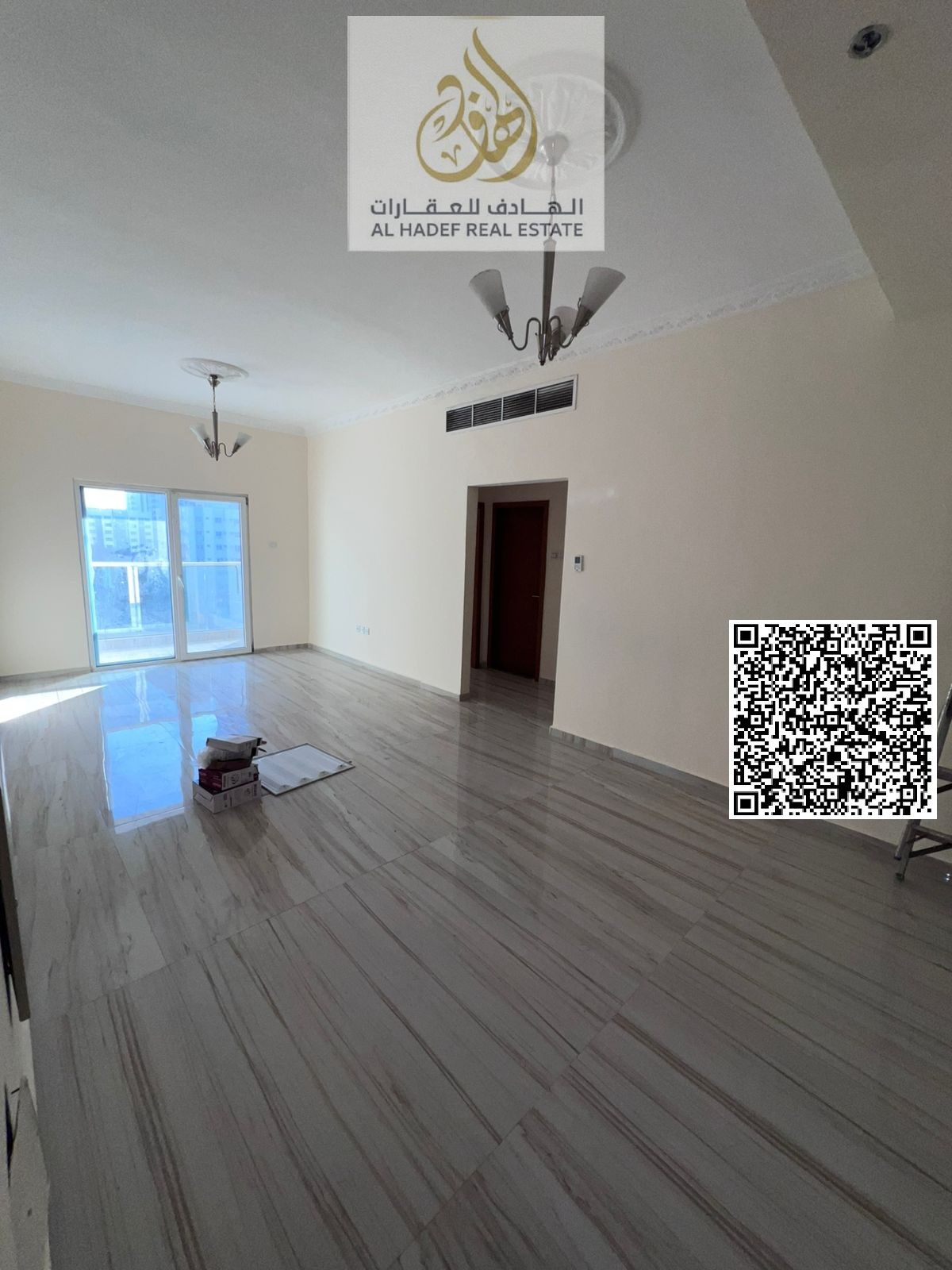 One bedroom, living room, balcony, two bathrooms, and a spacious kitchen.