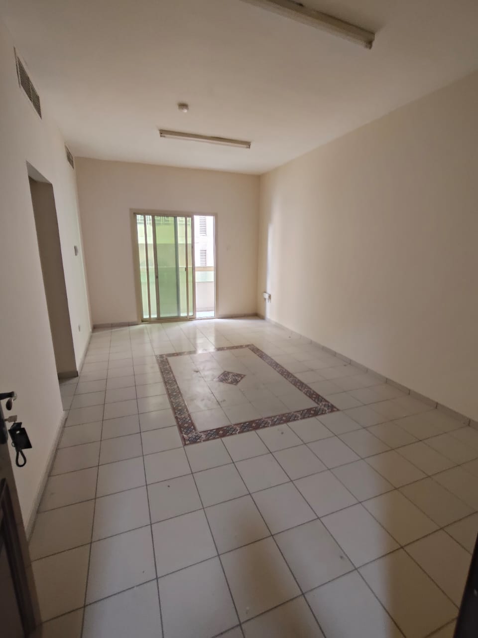 For annual rent in Sharjah, Al Qasimia area: one bedroom, living room, bathroom, and balcony. Excellent location close to all amenities.