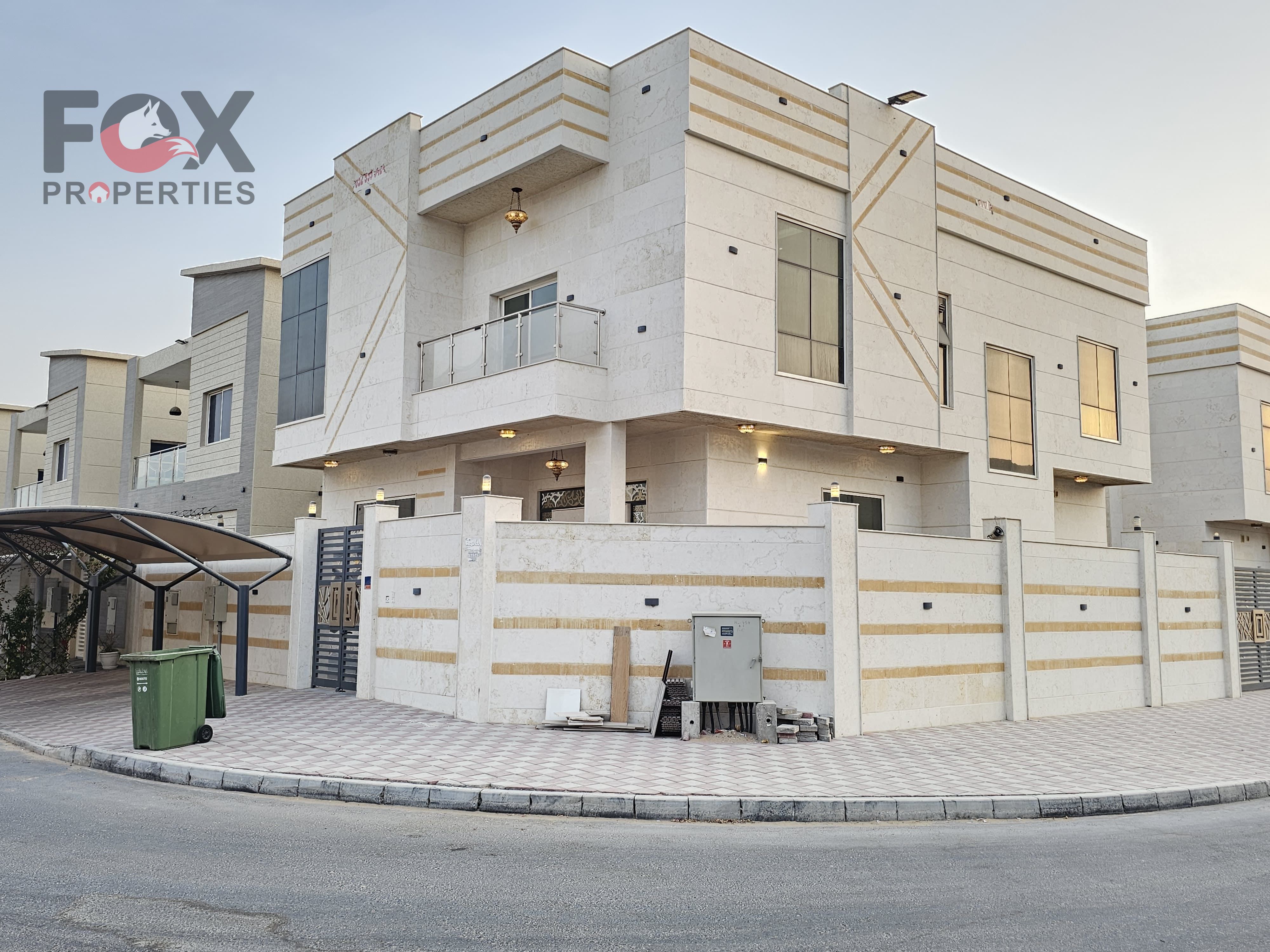 Near the Sheikh Mohammed Bin Zayed Road exit, with easy access to Sharjah and Dubai, and a residential villa area in Al Yasmin Corner.