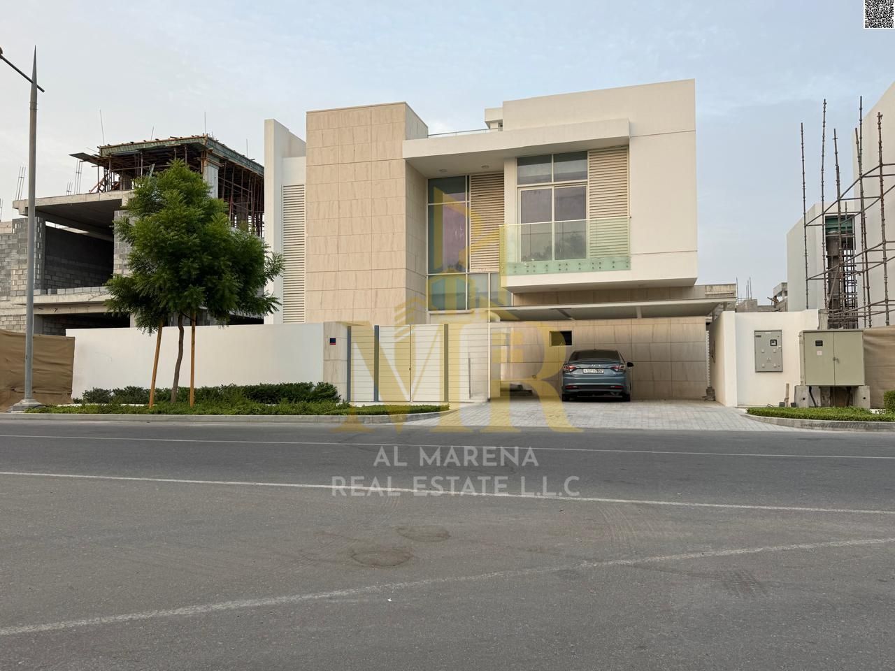 For sale: Villa in Al-Zorah area, two floors and a rooftop, surrounded by stunning natural scenery. Custom-finished and elegantly designed, overlookin