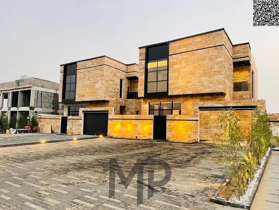 Villa for sale directly from the owner in Al Zahia with a 20-meter front setback and a stone facade. The villa includes registration and ownership fee