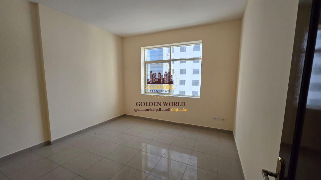 2BR apartment with living room in Al Khan, Sharjah. Central AC, 2 bathrooms, sand parking available. Prime location. Annual rent AED 44,000.