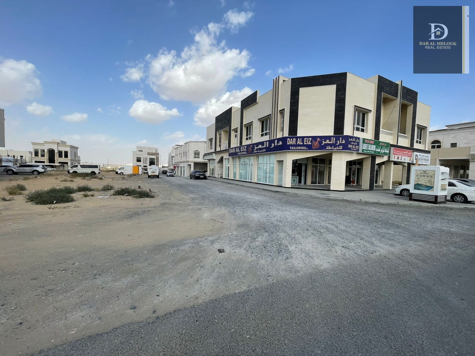 Corner commercial plot on three streets directly on Maliha Road, measuring 6006 sq ft – near Sharjah Grand Mosque