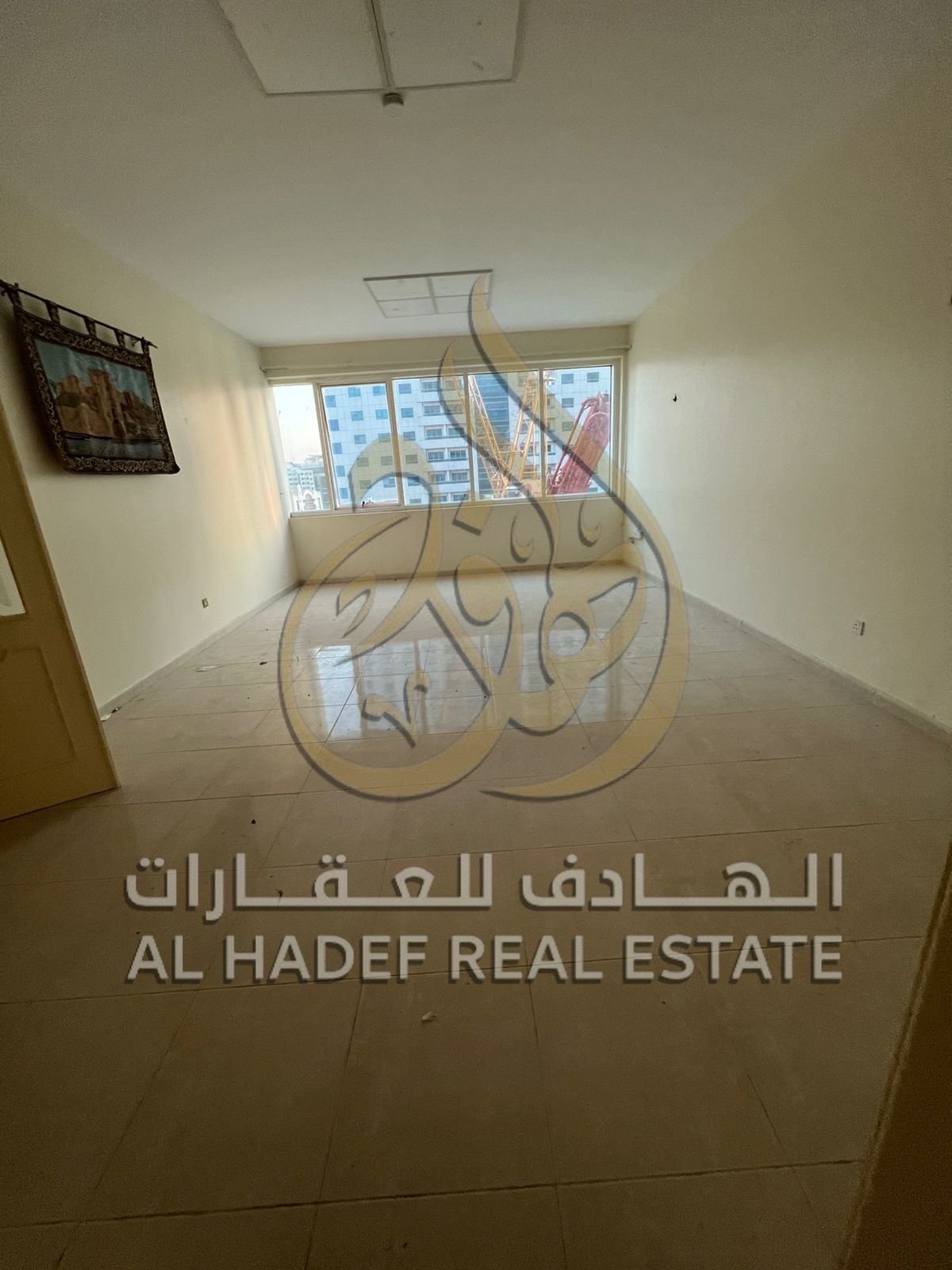 Two-bedroom apartment with a living room, spacious layout, for annual rent in Sharjah, Al Taawun area.