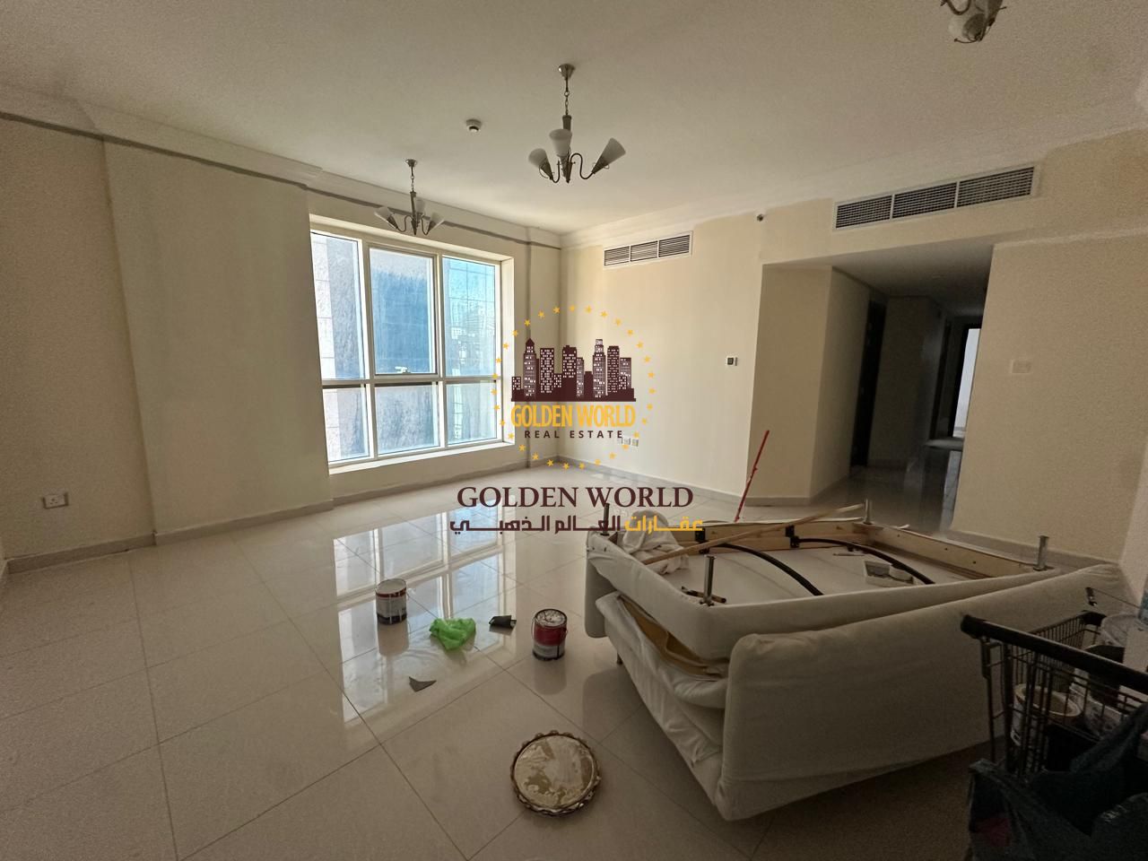 2BR + living room apartment in Al Majaz 2, no balcony, 3 bathrooms (1 master), annual rent AED 45,000, parking cash, 4 cheques.