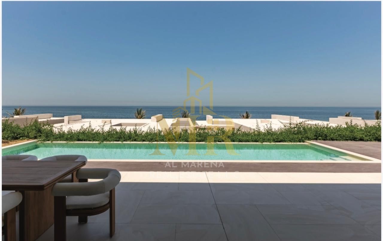 Villa with a direct view of Al Zorah Beach, 10,580 sq ft, 4 master bedrooms, living room and modern kitchen, prime location, price includes electricit