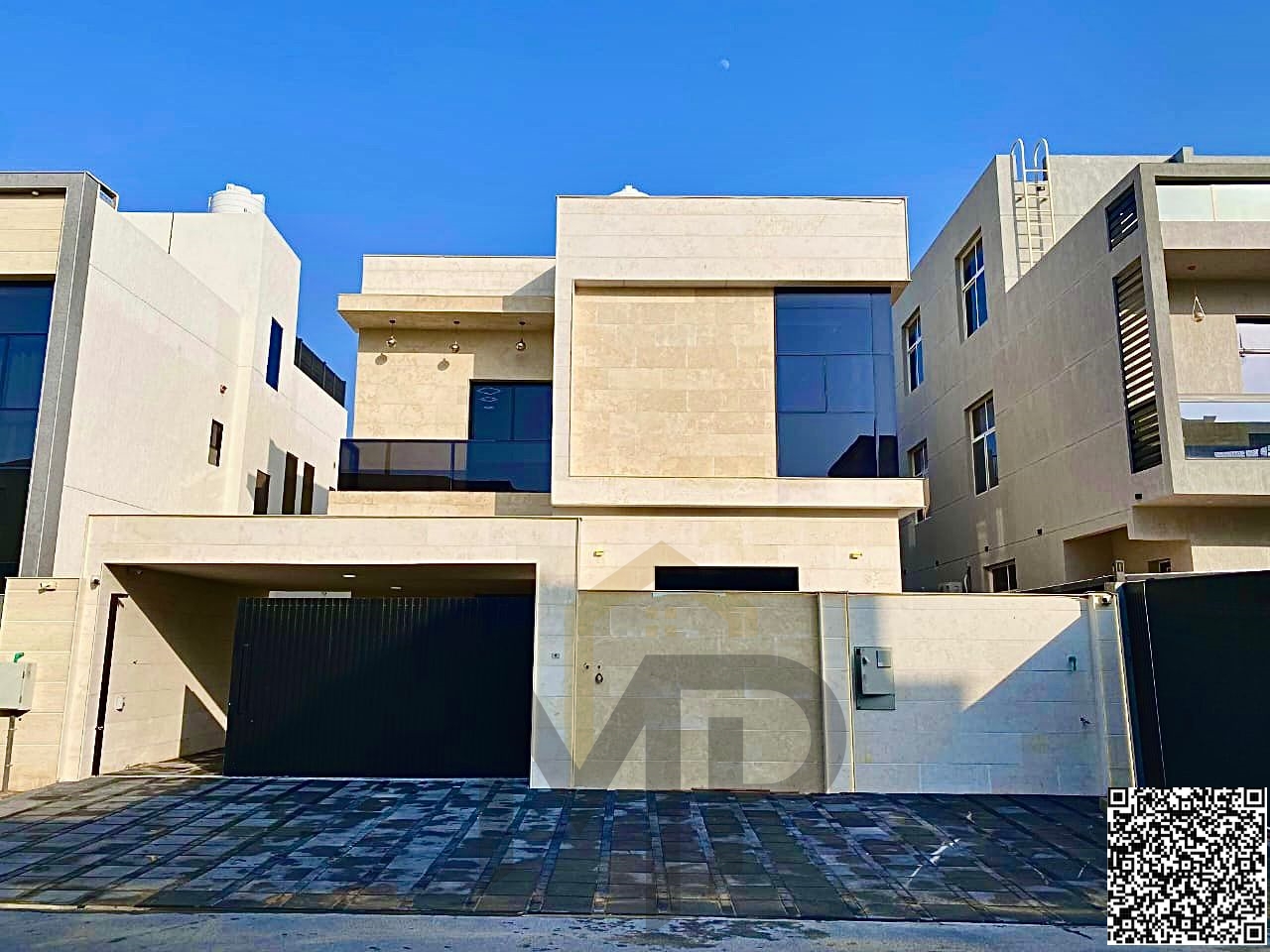 Luxury villa for sale with two floors and a roof, central air conditioning, and a spacious yard, near Sheikh Mohammed Bin Zayed Road, with freehold ow