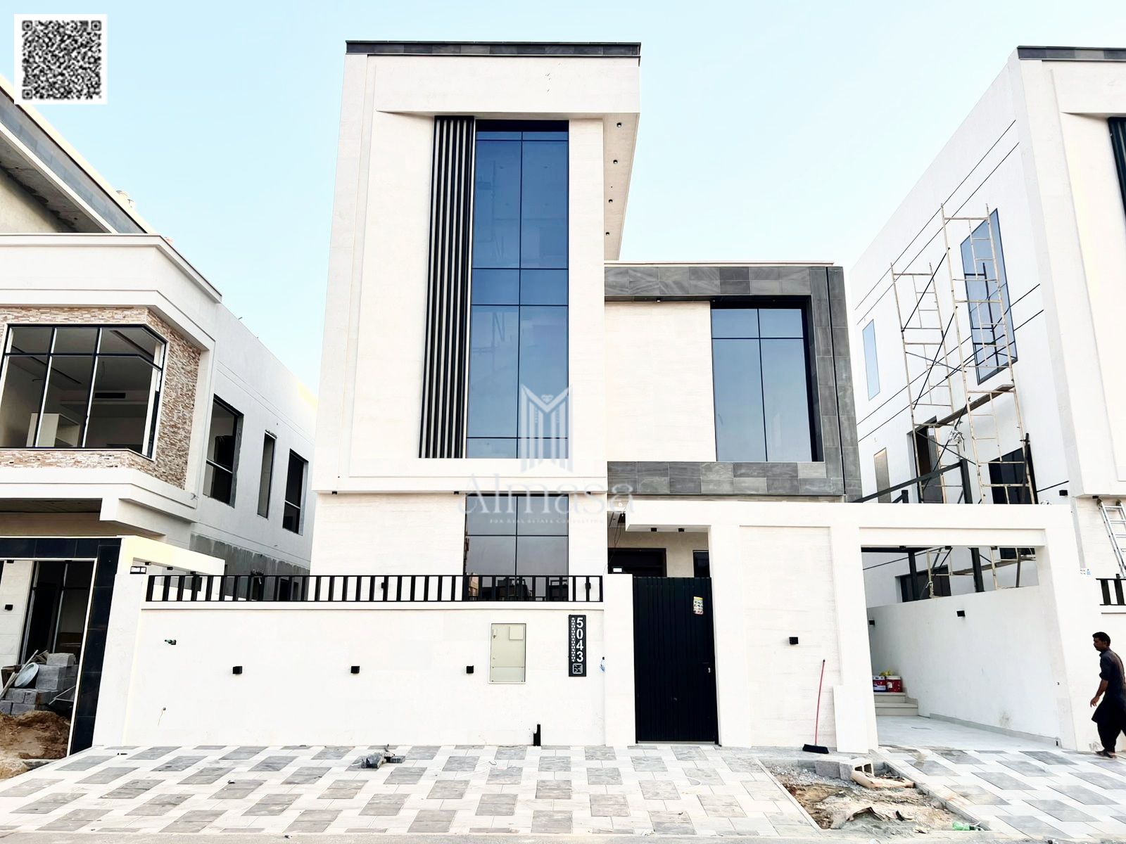 Modern villa with stone facade, deluxe finishing, and luxurious design.