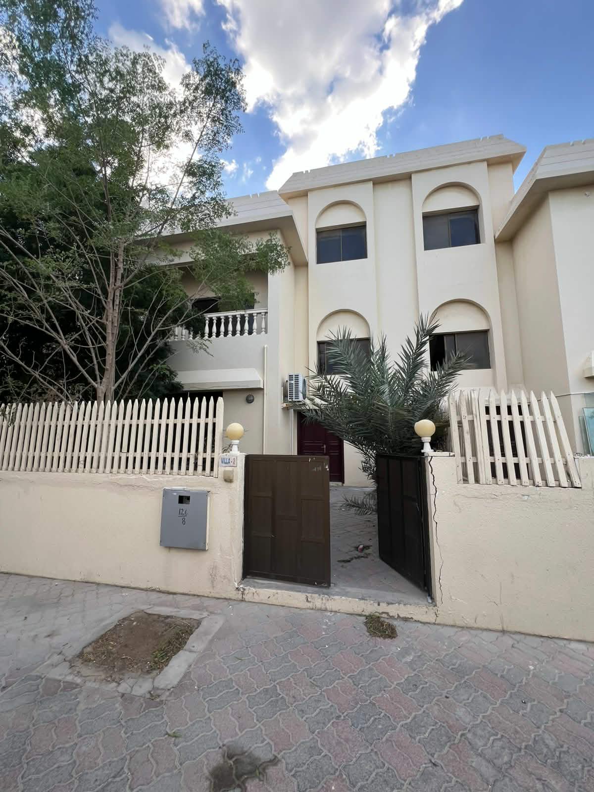 For rent, a modern villa on Al Heera Beach with direct sea view, spacious bedrooms, bathrooms, balconies, private garden, and a prime location near al