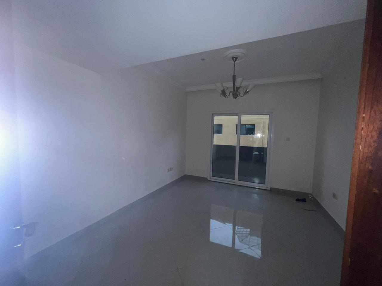 One-bedroom apartment with balcony in Al Taawun, first tenant after maintenance, built-in wardrobes, closed view, gym, pool, kids area, rent 39,000 AE
