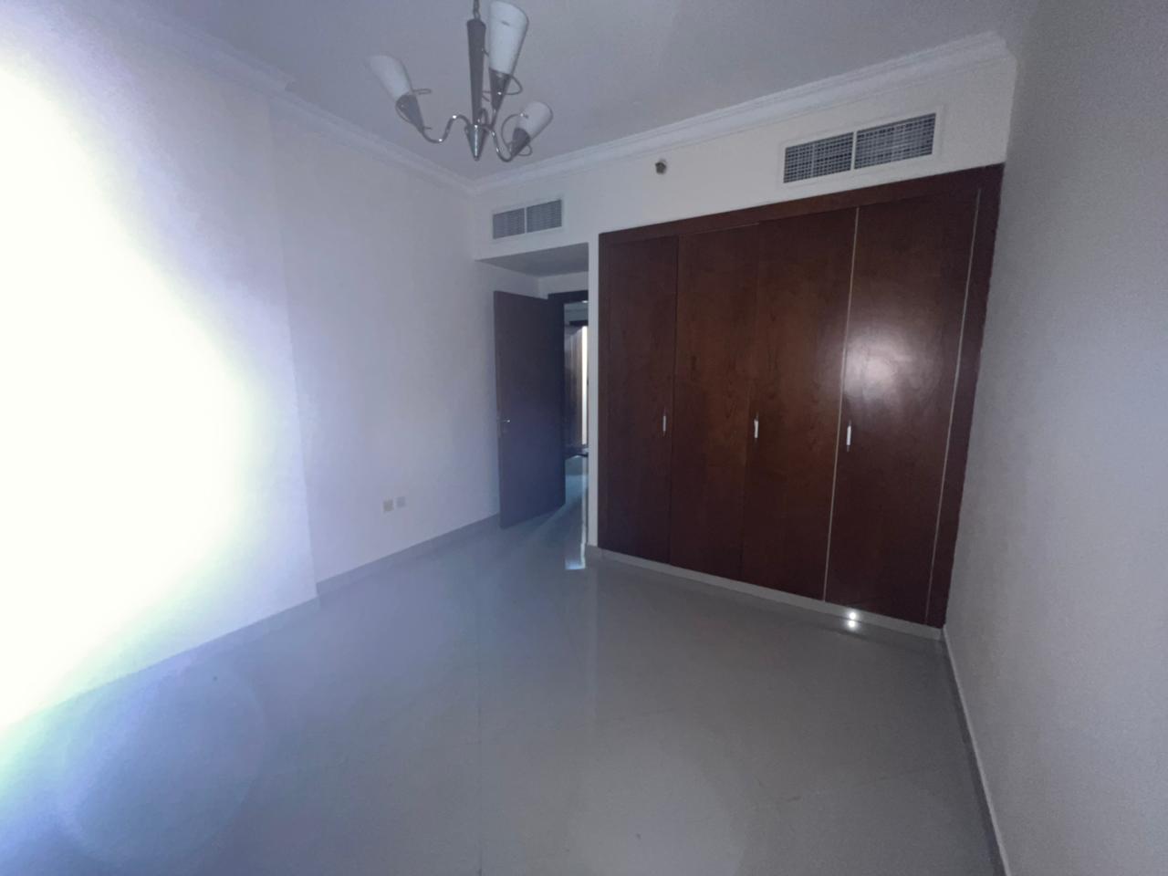 One-bedroom apartment with living room in Al Taawun, first tenant after maintenance, built-in wardrobes, gym, pool, kids area, close to Dubai, rent 39