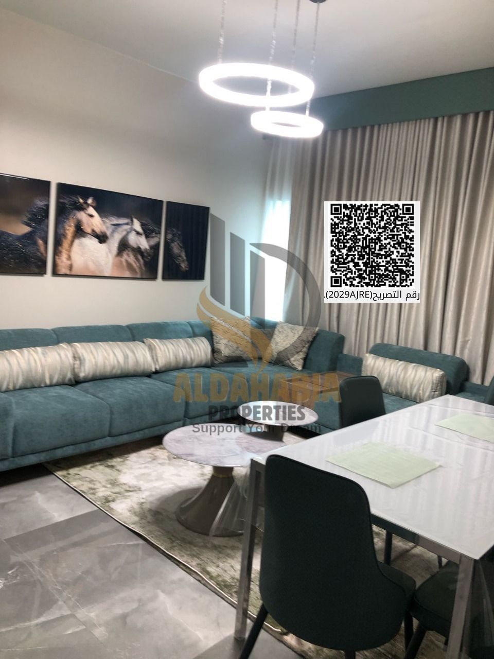 A one-bedroom apartment with a living room is for sale in Orient Towers, boasting stunning views of Ajman Creek