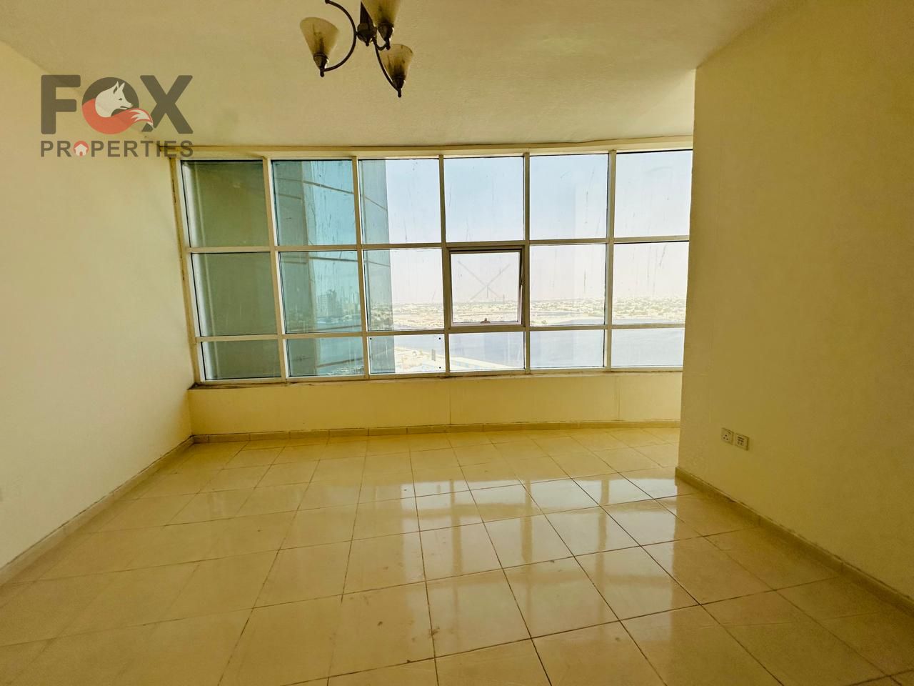 In the Eastern Towers, with an open view of the creek, a ready-to-move-in, unfurnished apartment is for sale with a down payment of 65,000 AED. Ajman,