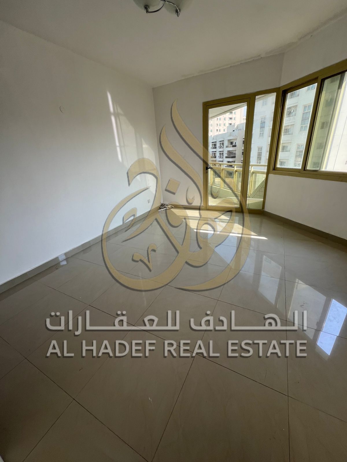 Two rooms and a living room, a master auxiliary room, 3 bathrooms, wardrobes, in a prime location in Al Majaz 2 area on Jamal Abdul Nasser Street, sui