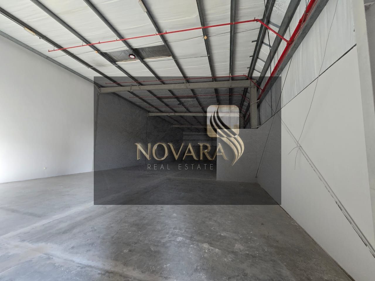 Warehouse for rent with an area of 11,191 feet, 22 KV electricity, suitable for storage and operation, at a price of 559,578 dirhams per year.