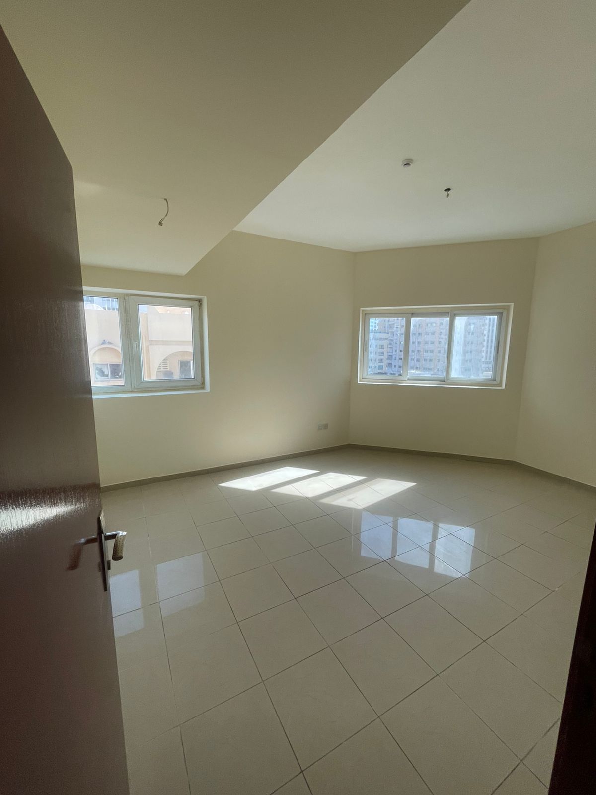An elegant 2-bedroom apartment in Al Merija – Sharjah, offering a spacious and comfortable layout with a balcony, two bathrooms, central AC, and a qui